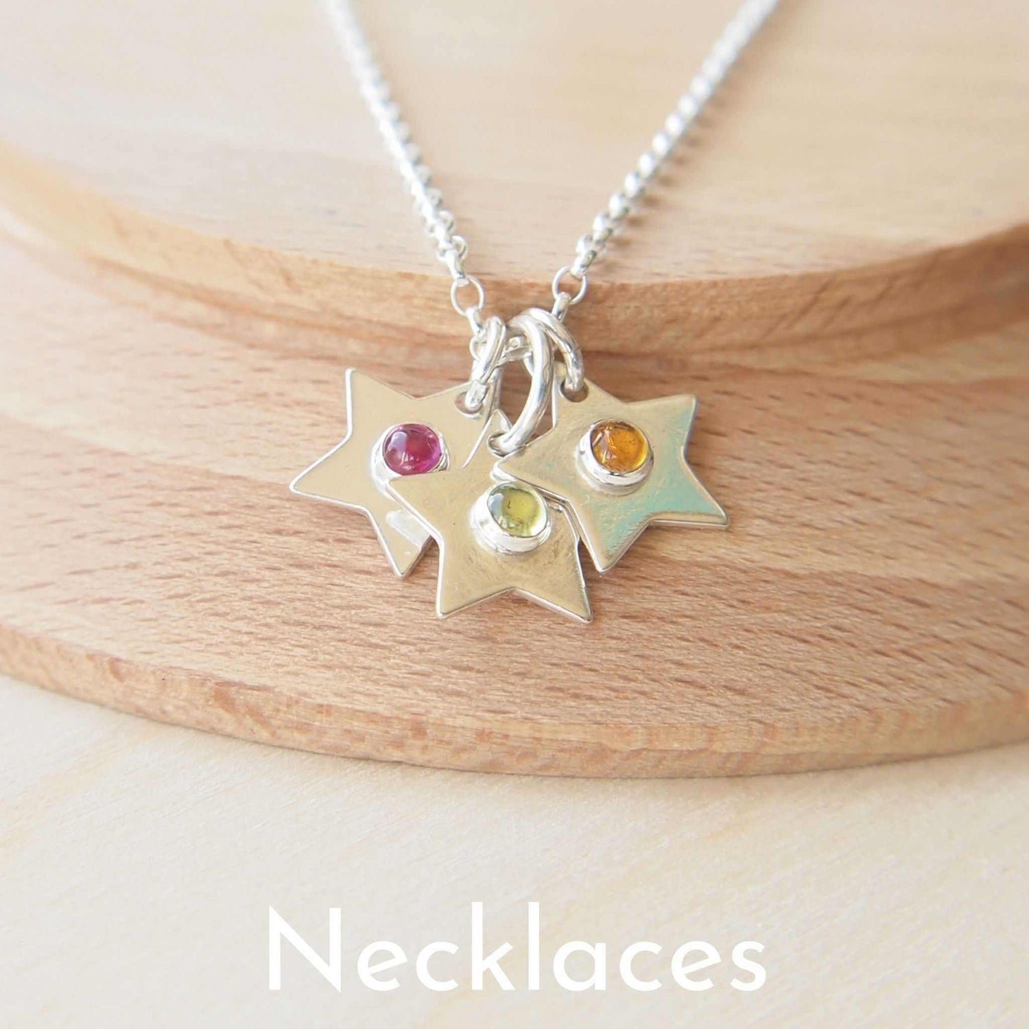 Sterling Silver star cluster necklace in silver and mixed birthstones. Handmade in Scotland by maram jewellery
