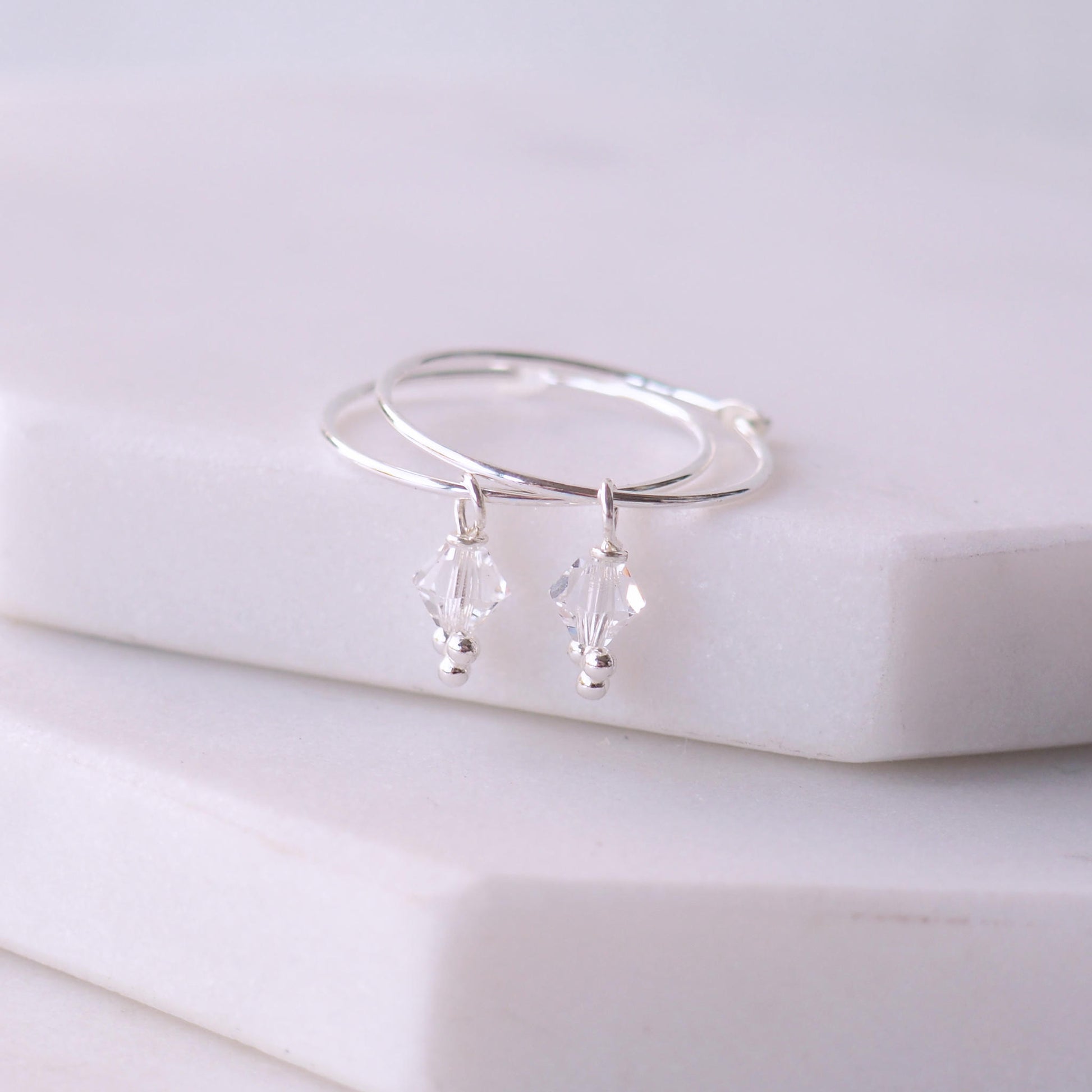 Birthstone Hoops with April clear diamond Crystal droppers. Simple boho style for all ages. Made in Scotland by maram jewellery