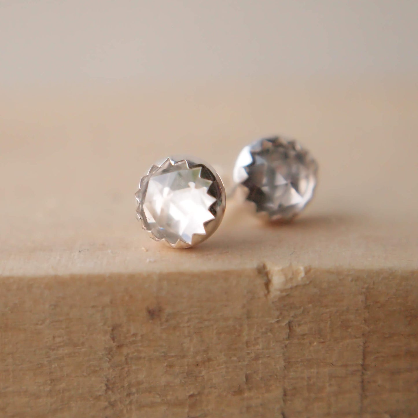 White Topaz simple Silver and gemstone earrings. April Birthstones with a clear facet cut white topaz and a simple sterling silver setting, handmade by maram jewellery in Edinburgh Scotland UK