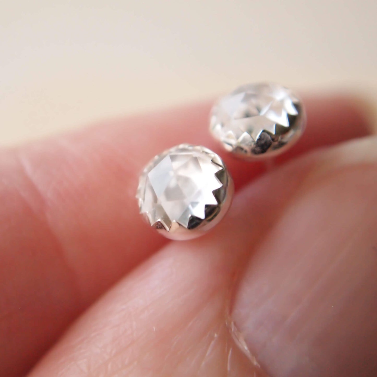 White Topaz simple Silver and gemstone earrings. April Birthstones with a clear facet cut white topaz and a simple sterling silver setting, handmade by maram jewellery in Edinburgh Scotland UK