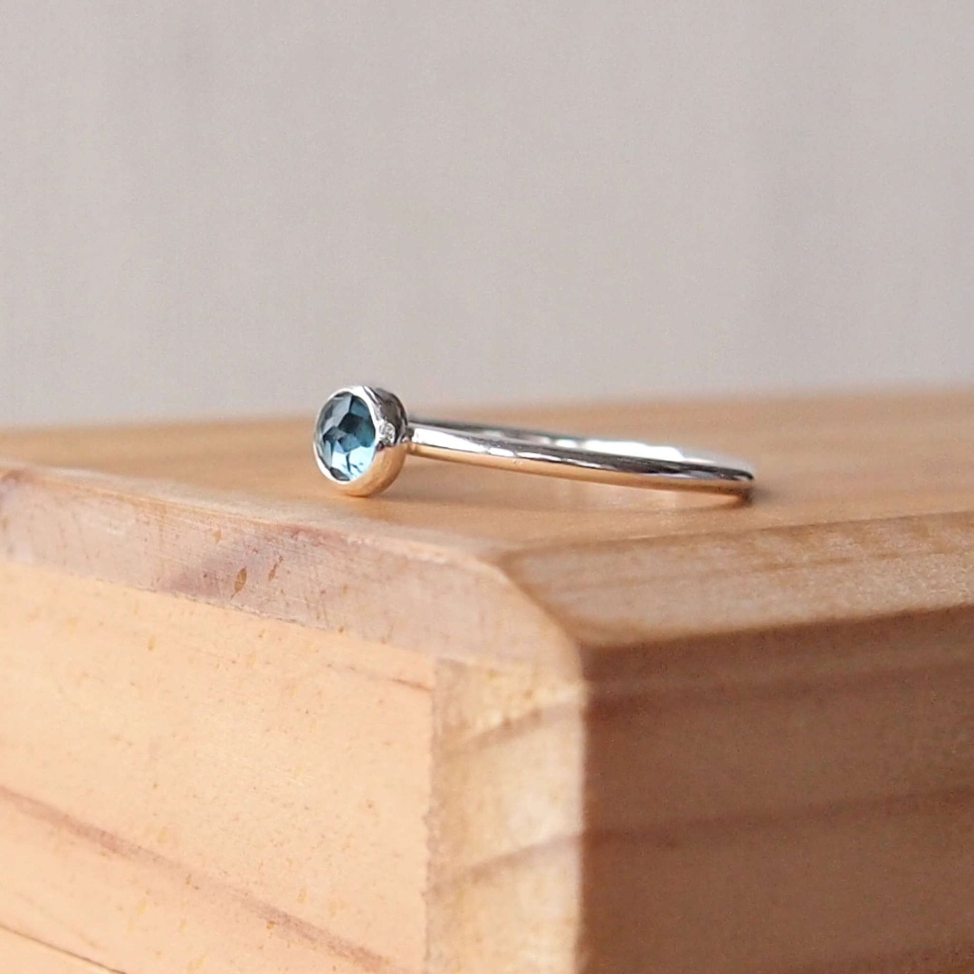 London Blue Topaz Sterling Silver Gemstone ring with a round 5mm facet cut teal Blue cabochon. Handmade in Scotland by maram jewellery