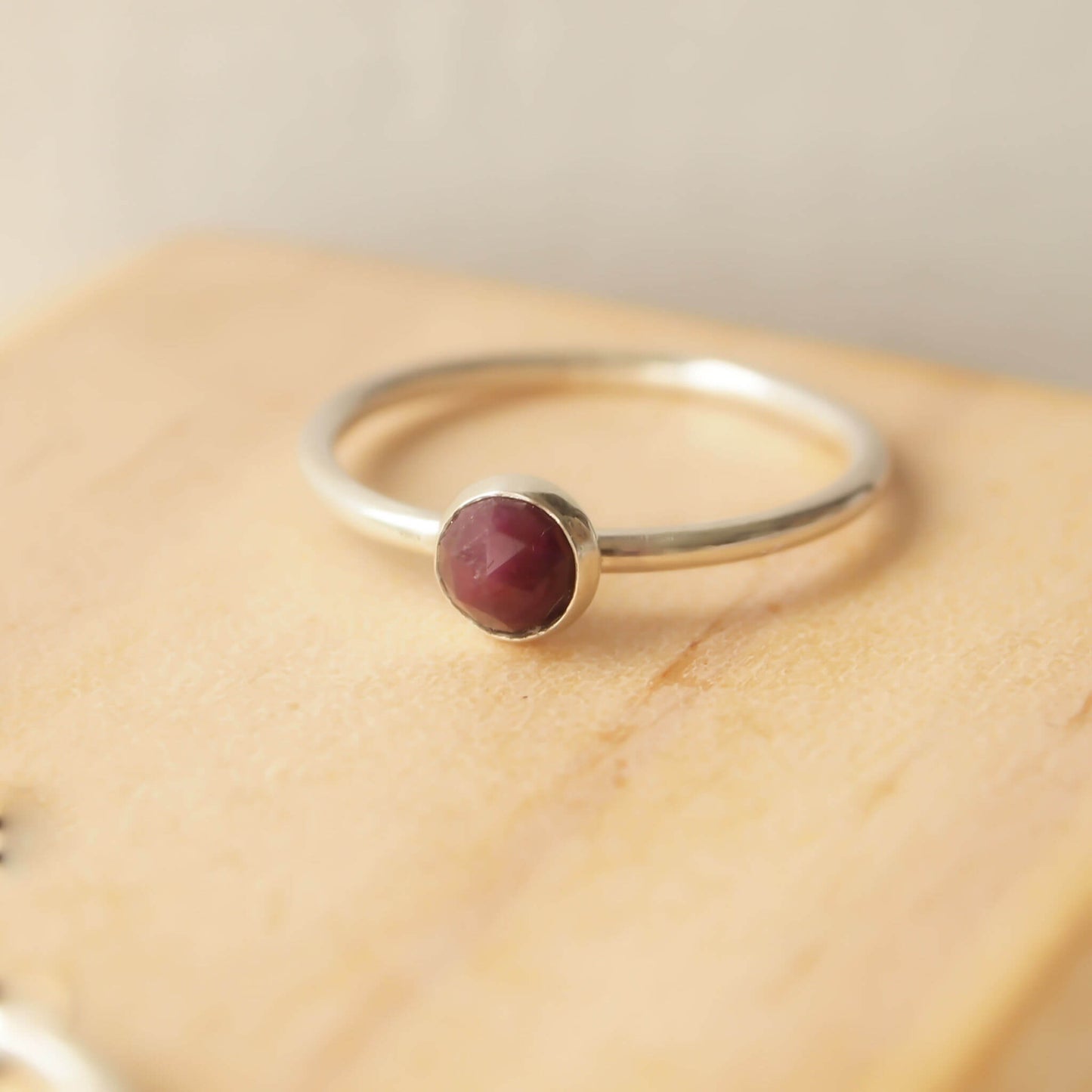 ruby and sterling silver facet cut solitaire birthstone ring