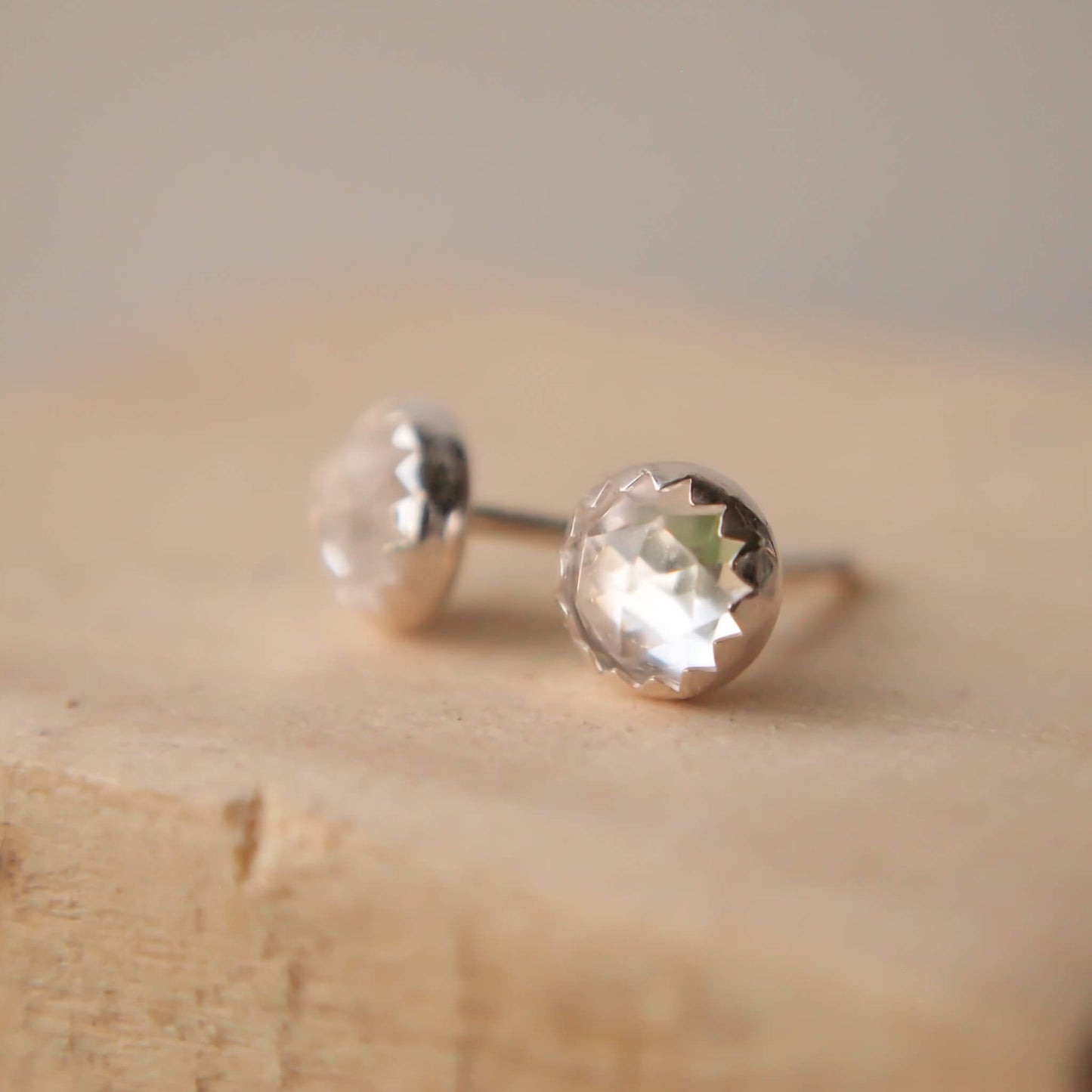 White Topaz simple Silver and gemstone earrings. April Birthstones with a clear facet cut white topaz and a simple sterling silver setting, handmade by maram jewellery in Edinburgh Scotland UK