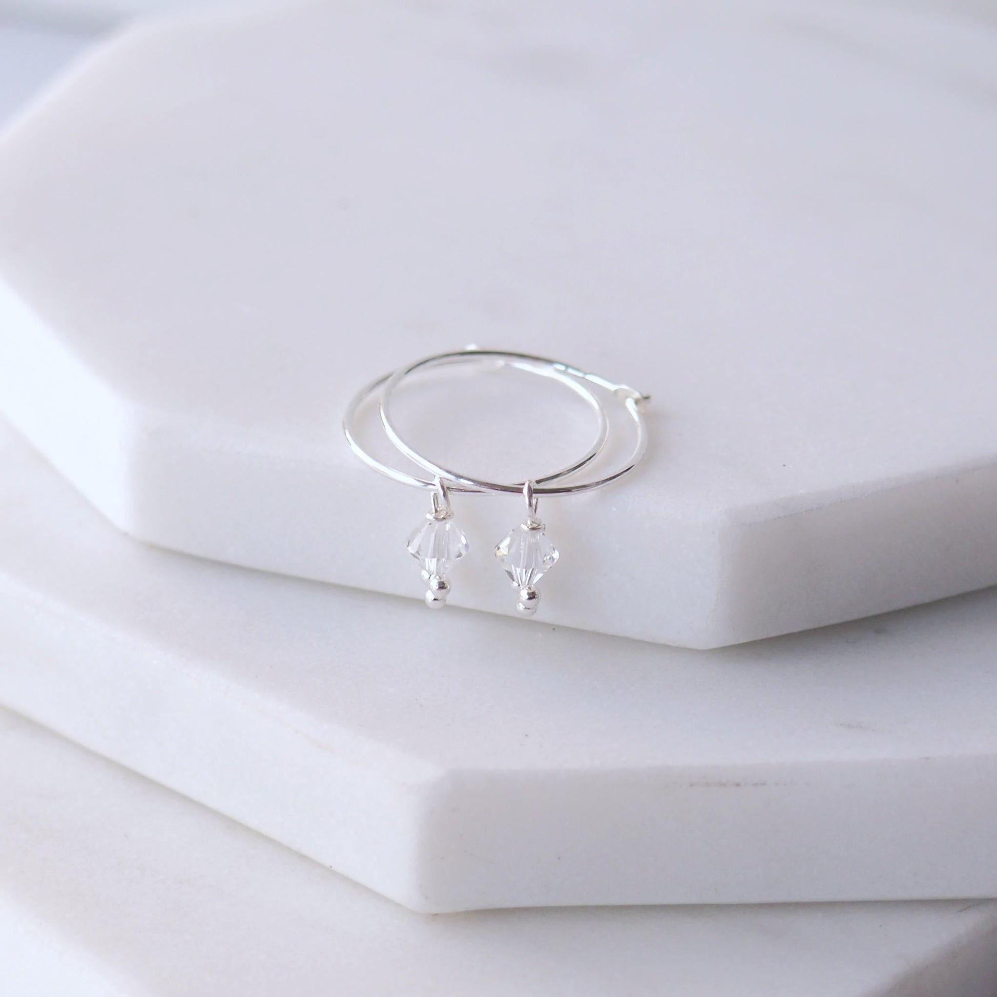 Birthstone Hoops with April clear diamond Crystal droppers. Simple boho style for all ages. Made in Scotland by maram jewellery