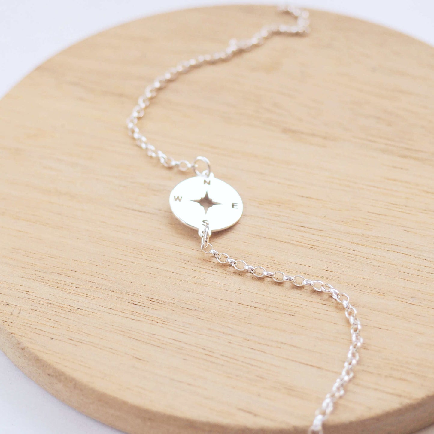 Compass Silver bracelet with a circle stamped direction compass as a centre focal. Handmade by maram jewellery in Edinburgh UK
