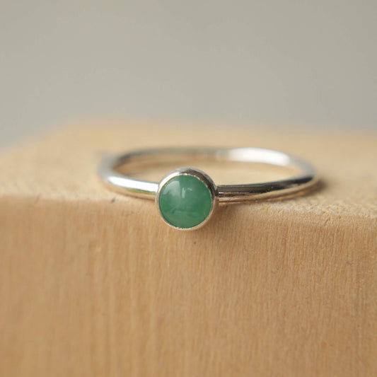 Simple Silver and Emerald ring with a round 5mm green emerald, May's Birthstone. Handmade by Maram Jewellery in Scotland