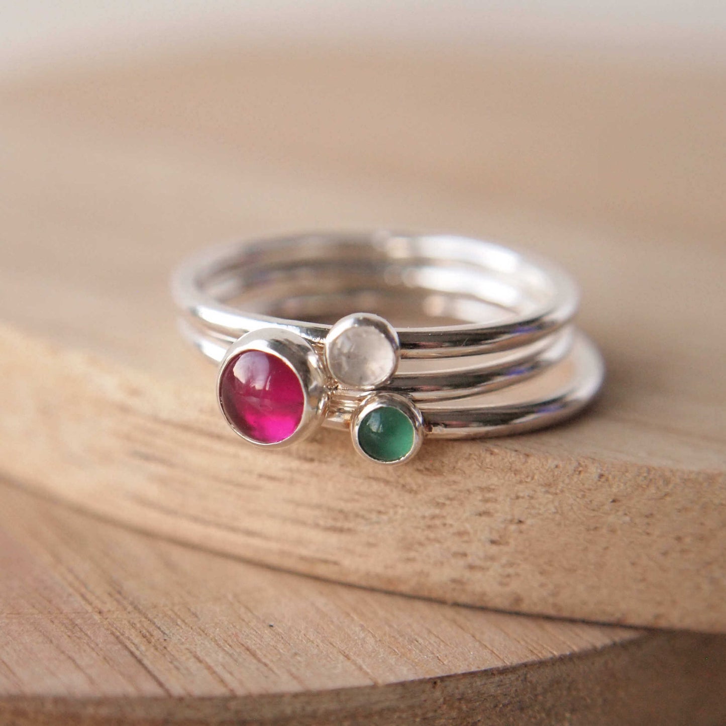 Three ring birthstone ring set made from sterling silver and three gemstones. This set has Lab Ruby, Moonstone and Green Agate to mark July, June and May Birthstones.  Handmade in Scotland by Maram Jewellery