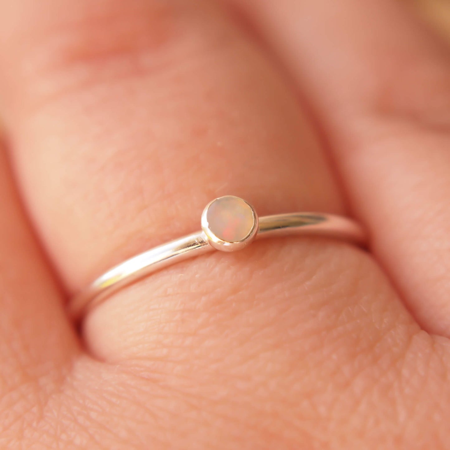 Sterling Silver and genuine Opal Silver ring on a fully round band. Handmade in Scotland by maram jewellery