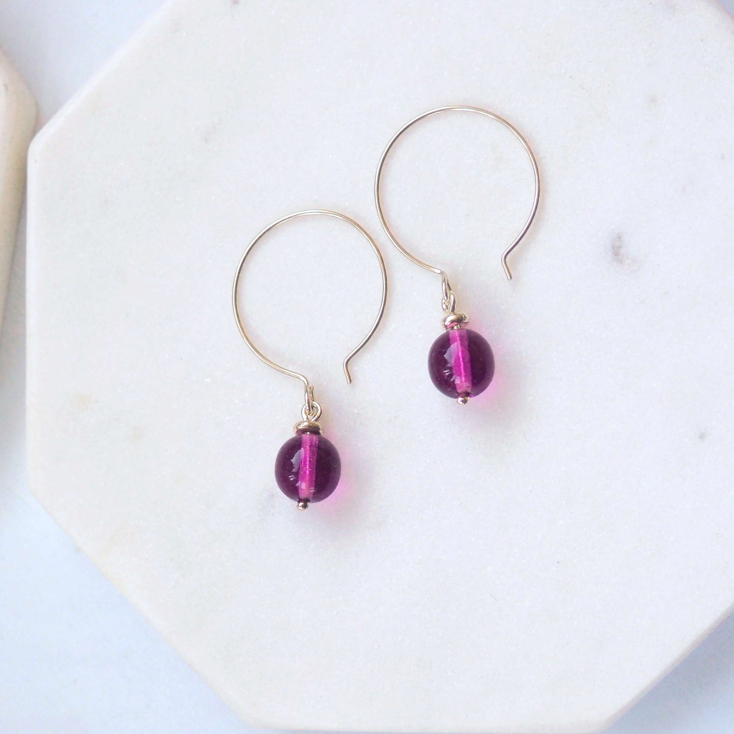 Purple Silver minimalist handmade silver hoops. Handcrafted ear wires with a round glass bead dropper. Made in Scotland by maram jewellery
