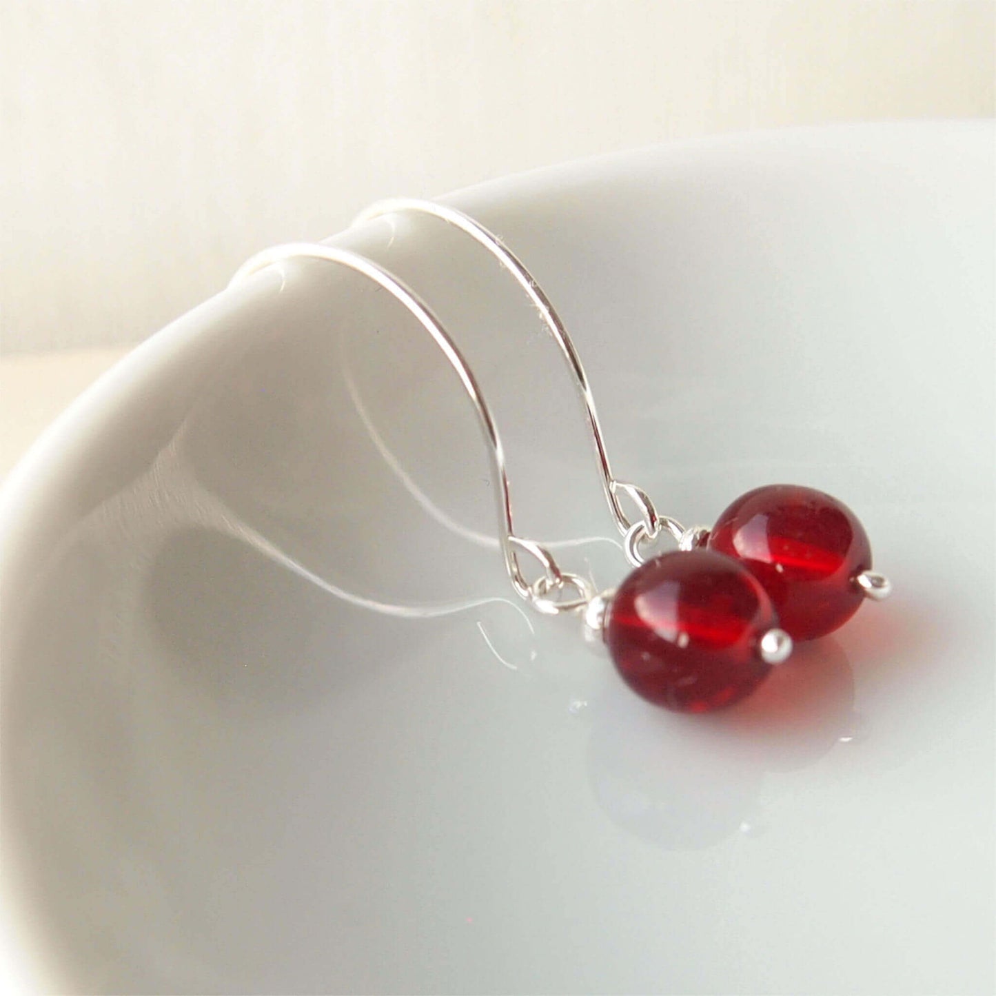 Red Silver minimalist handmade silver hoops. Handcrafted ear wires with a round glass bead dropper. Made in Scotland by maram jewellery