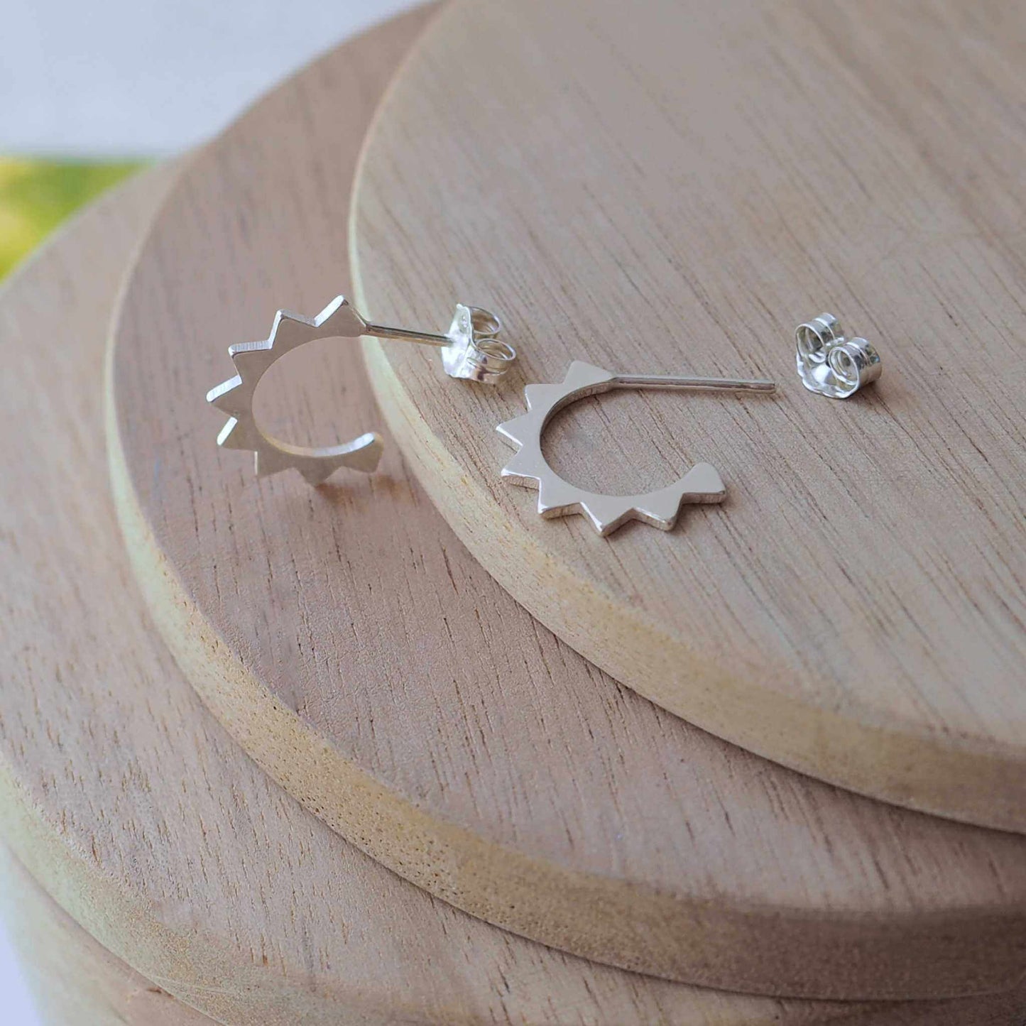 Sterling silver hoop earrings with a geometric look with angular zigzag edge