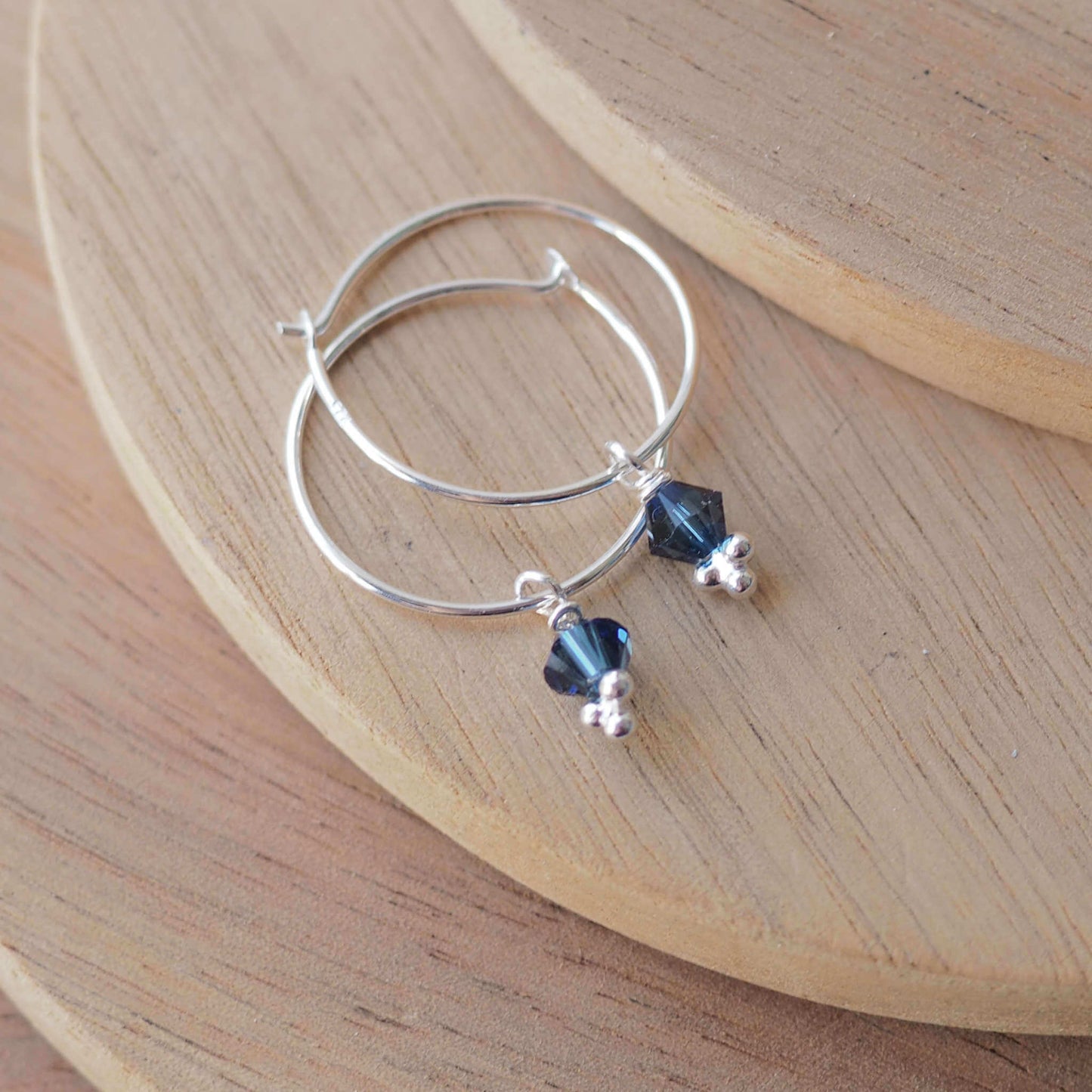 Teal Crystal simple wire hoop earrings with a crystal dropper in a petrol blue. Handmade in Scotland UK by maram jewellery
