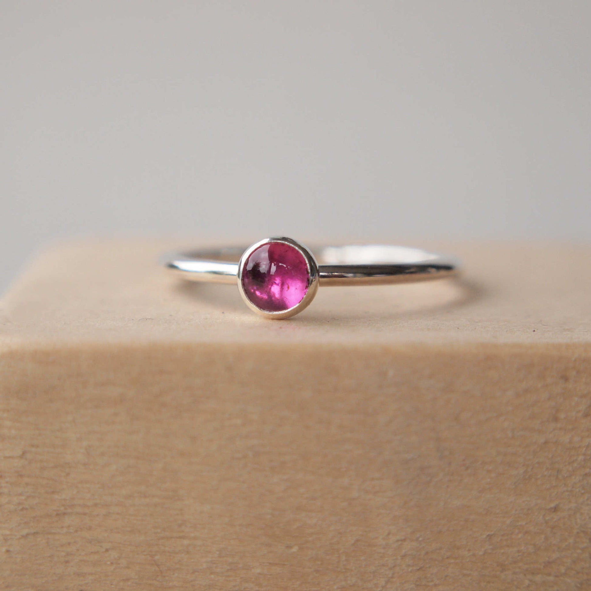 Solitaire Pink gemstone ring made from Sterling SIlver and Pink Tourmaline. The stone is round and measures 5mm in diameter. Handmade by maram jewellery in Scotland