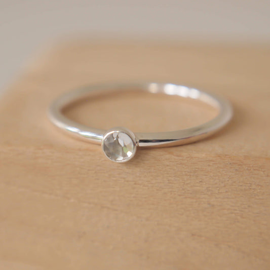 White Topaz and Silver ring. Clear faceted gemstone on a sterling silver band. Handmade in Scotland by maram jewellery