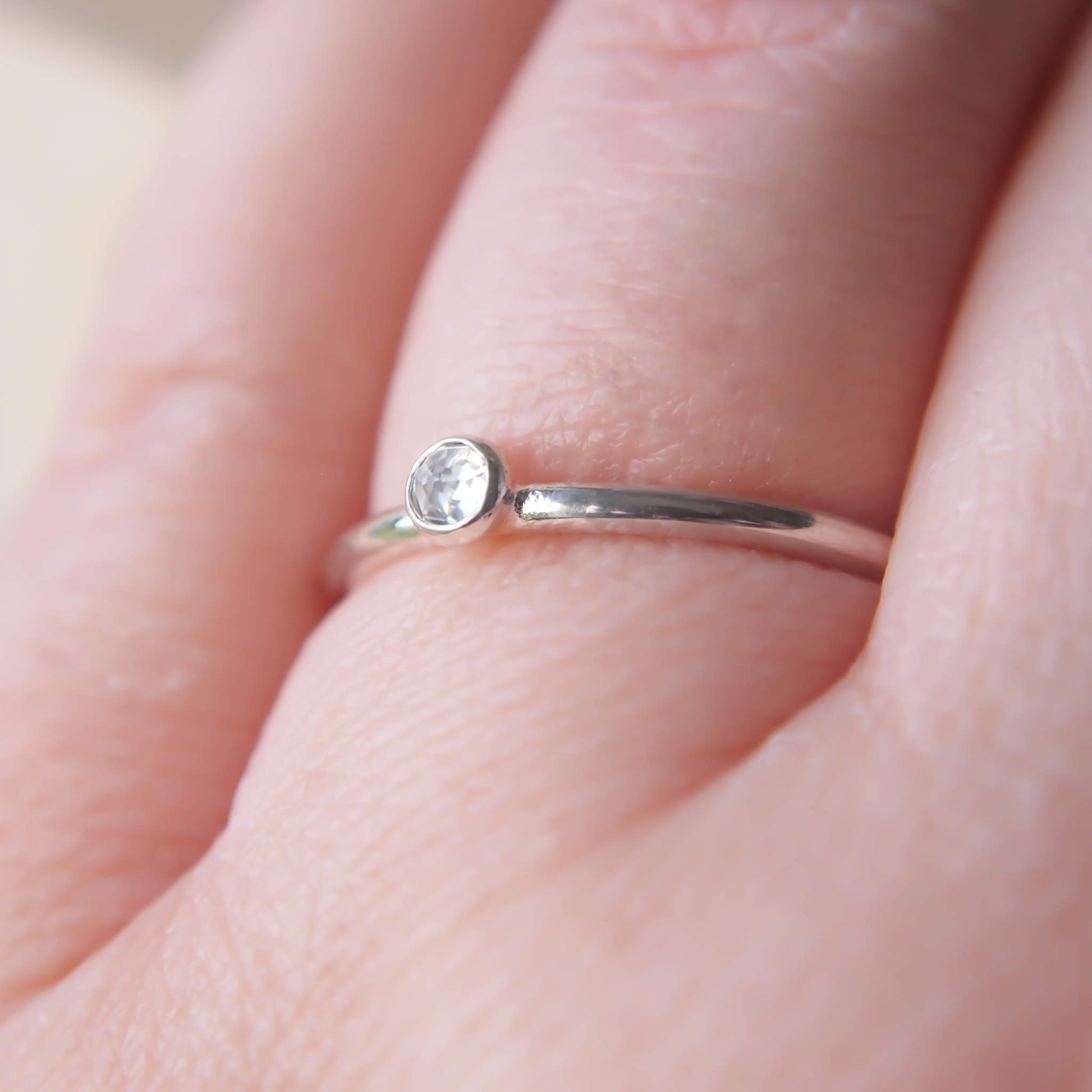 White Topaz and Sterling Silver simple minimalist ring with a 3mm round clear facet cut White Topaz, Birthstone for April. Handmade in Scotland by maram jewellery