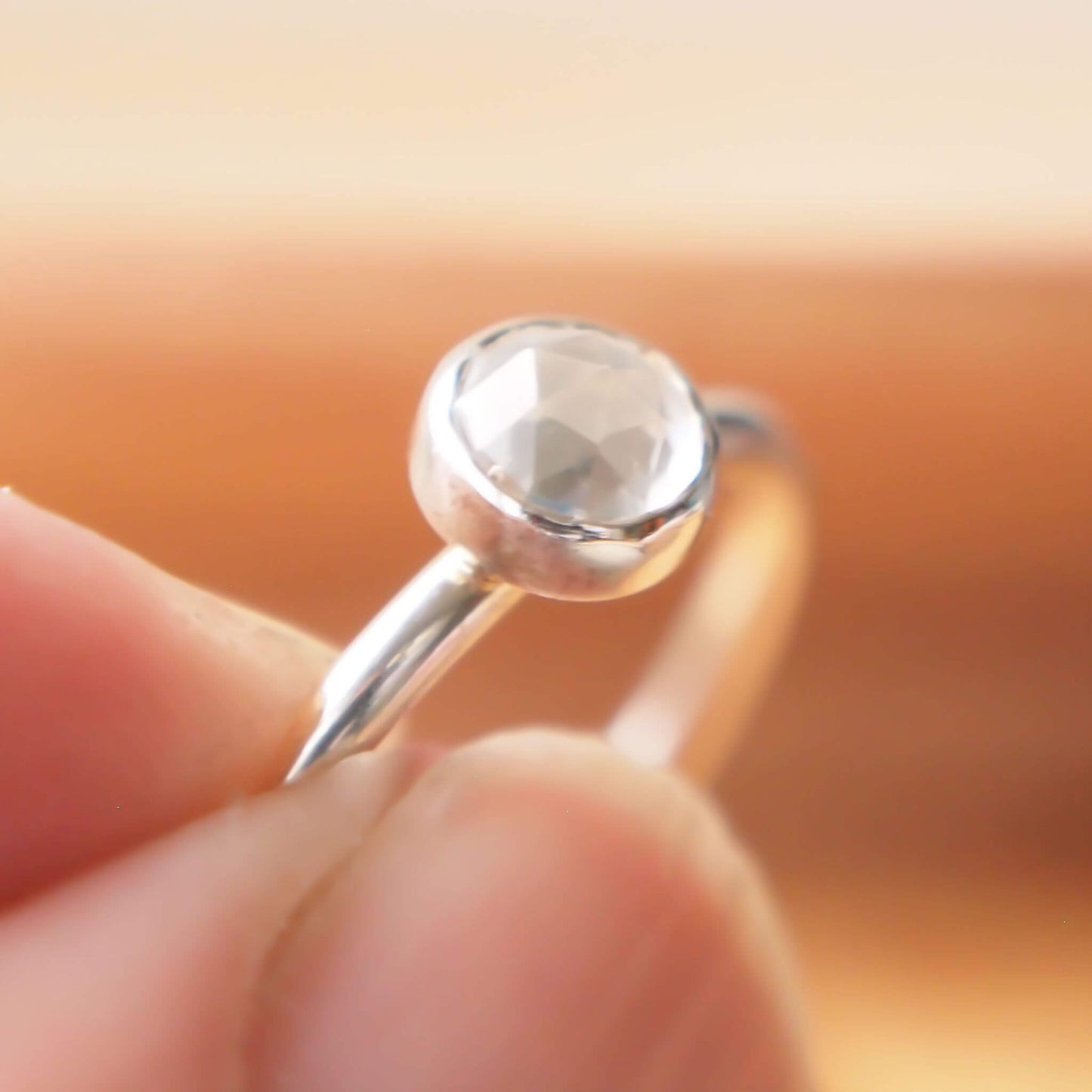 White Topaz and Sterling Silver simple minimalist ring with a 5mm round clear facet cut White Topaz, Birthstone for April. Handmade in Scotland by maram jewellery