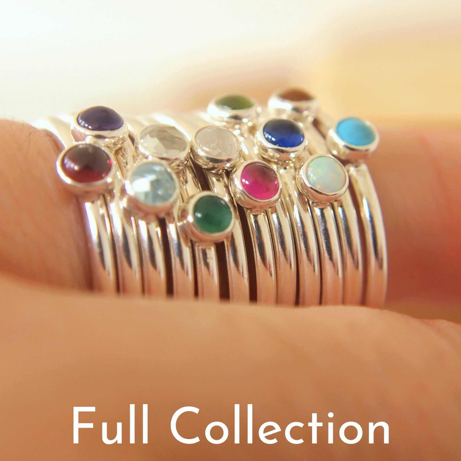 Stack of birthstone rings by maram jewellery with an assortment of gems made from Sterling Silver. Handmade in Scotland