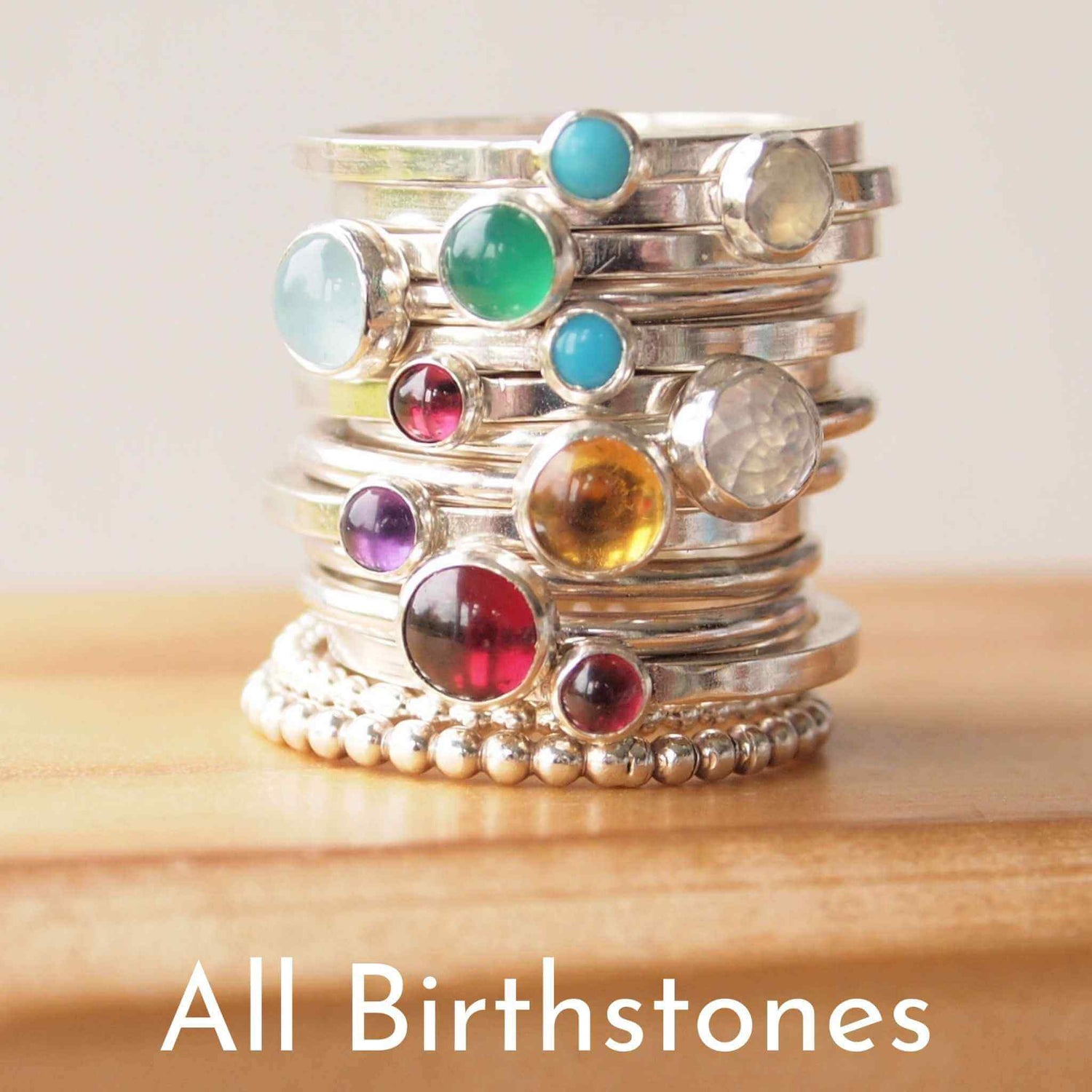 Stack of birthstone rings by maram jewellery with an assortment of gems made from Sterling Silver. Handmade in Scotland