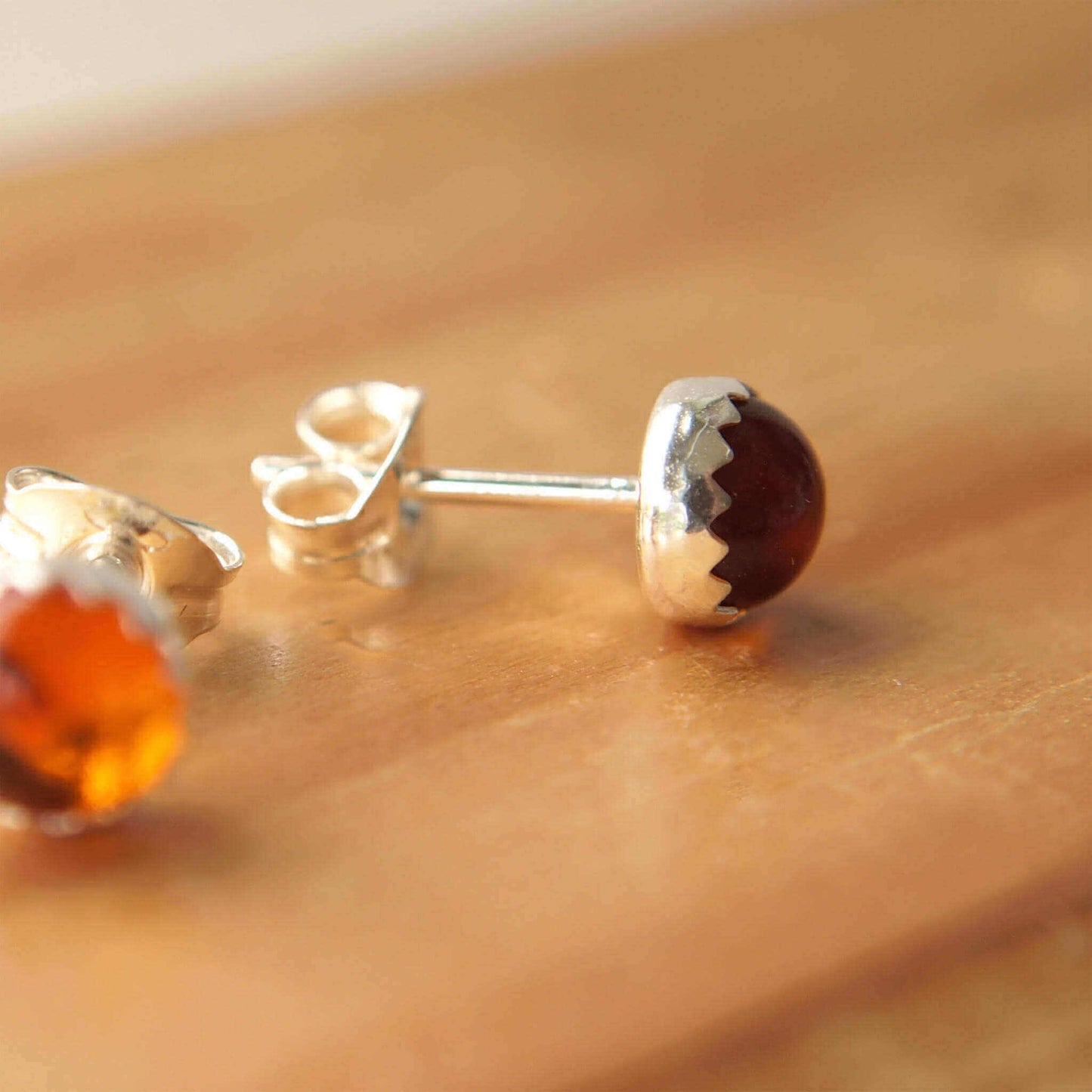 Simple silver and genuine amber gemstone studs, 5mm round with a decorative edge, handmade in Scotland by maram jewellery
