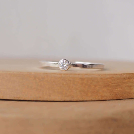 Minimalist style small gemstone Solitaire ring in sterling silver with a square wire band and a 3mm round cubic zirconia. Handmade in Scotland UK by maram jewellery