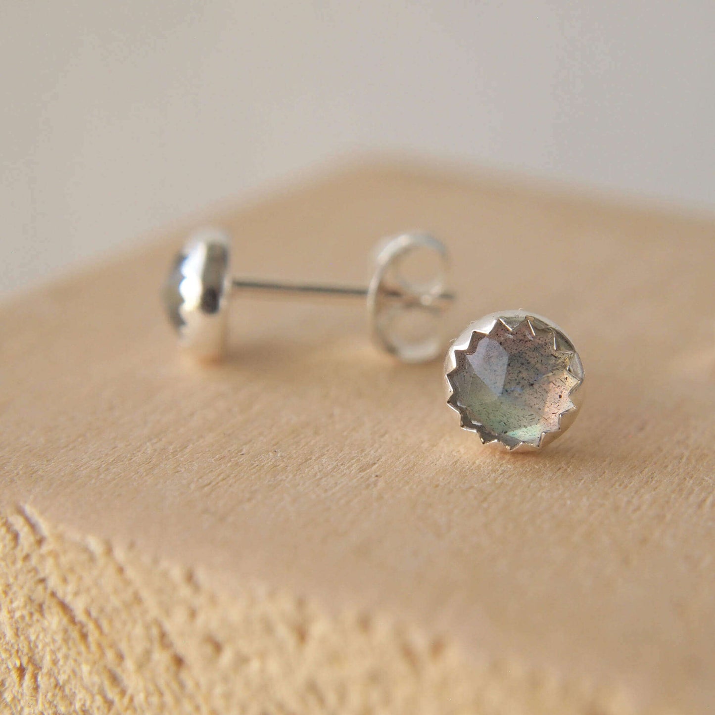Sterling Silver and Labradorite gemstone modern simple stud earrings. measuring 5mm in size these have 5mm facet cut labradorite gemstones set into simple Sterling silver surrounds. handcrafted by maram jewellery in Scotland UK