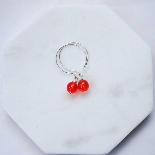 Orange Silver minimalist handmade silver hoops. Handcrafted ear wires with a round glass bead dropper. Made in Scotland by maram jewellery