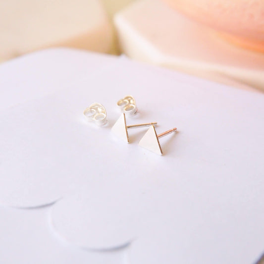 Small silver Stud earrings on a white background. Earrings suitable for cartilage piercings and multi piercings and mix and matching. Handmade in Scotland by maram jewellery