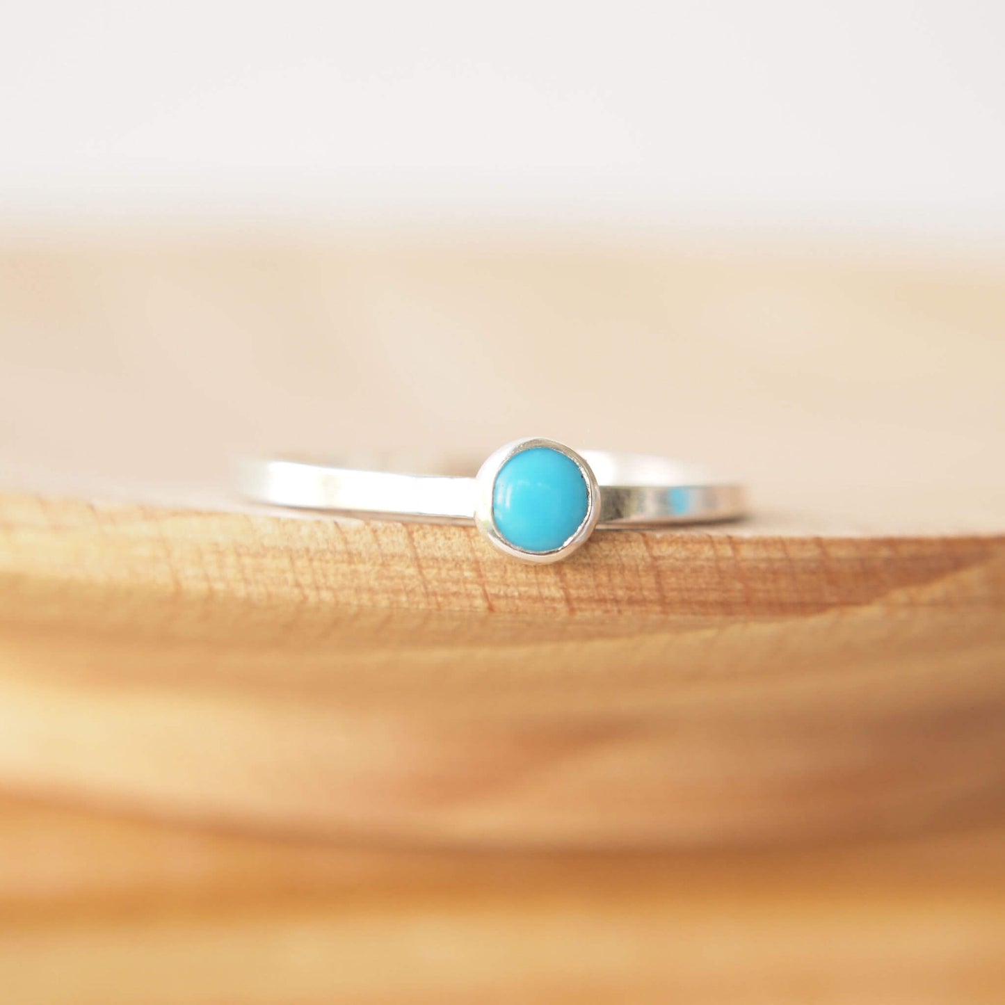 Turquoise Sterling Silver Gemstone ring with a round 4mm cabochon in Turquoise, Birthstone for December. The band is square profile, making it a modern solitaire ring. Handmade in Scotland by maram jewellery