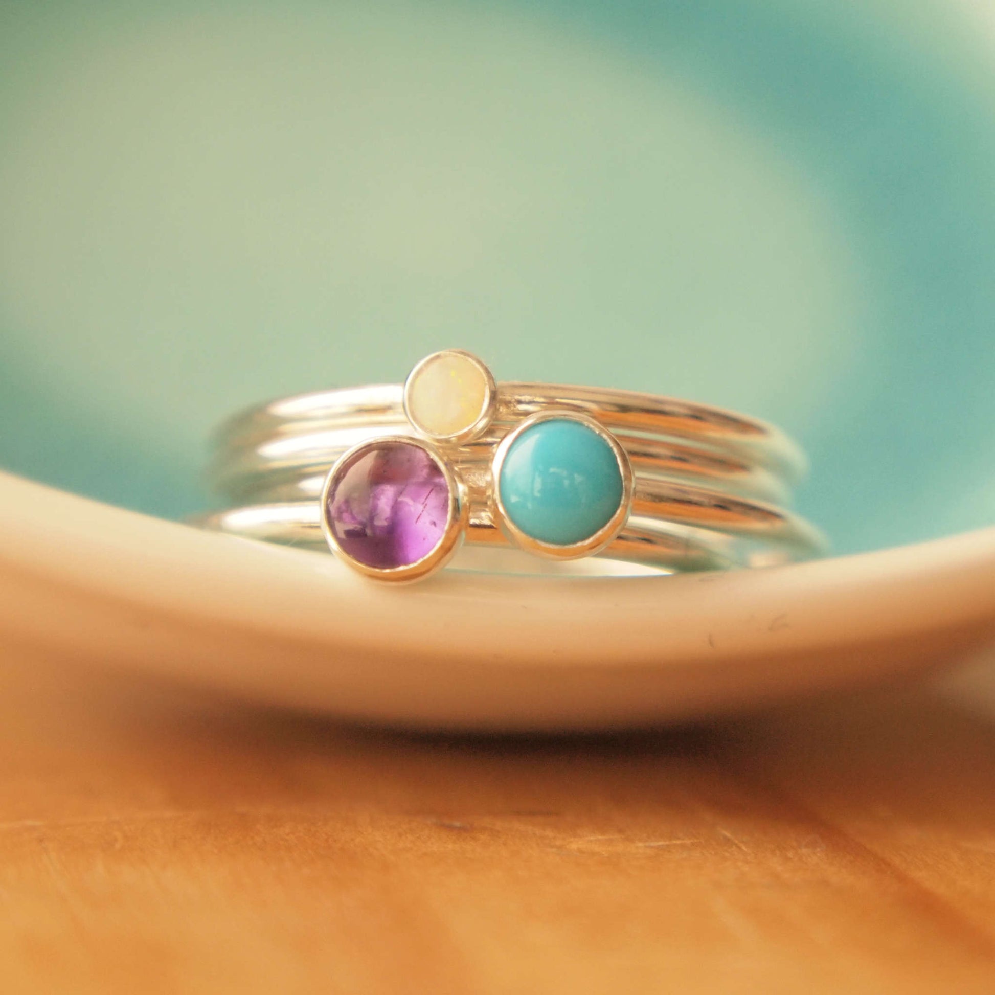 Family Birthstone Ring set with Amethyst, Turquoise and Opal in Sterling Silver. Handmade by maram jewellery in Scotland