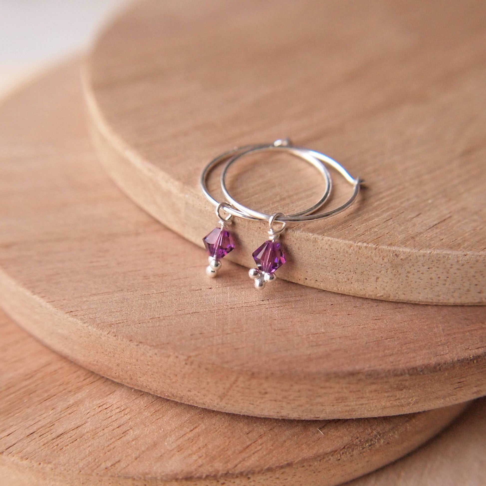 Amethyst purple crystal earrings on a sterling silver hoop