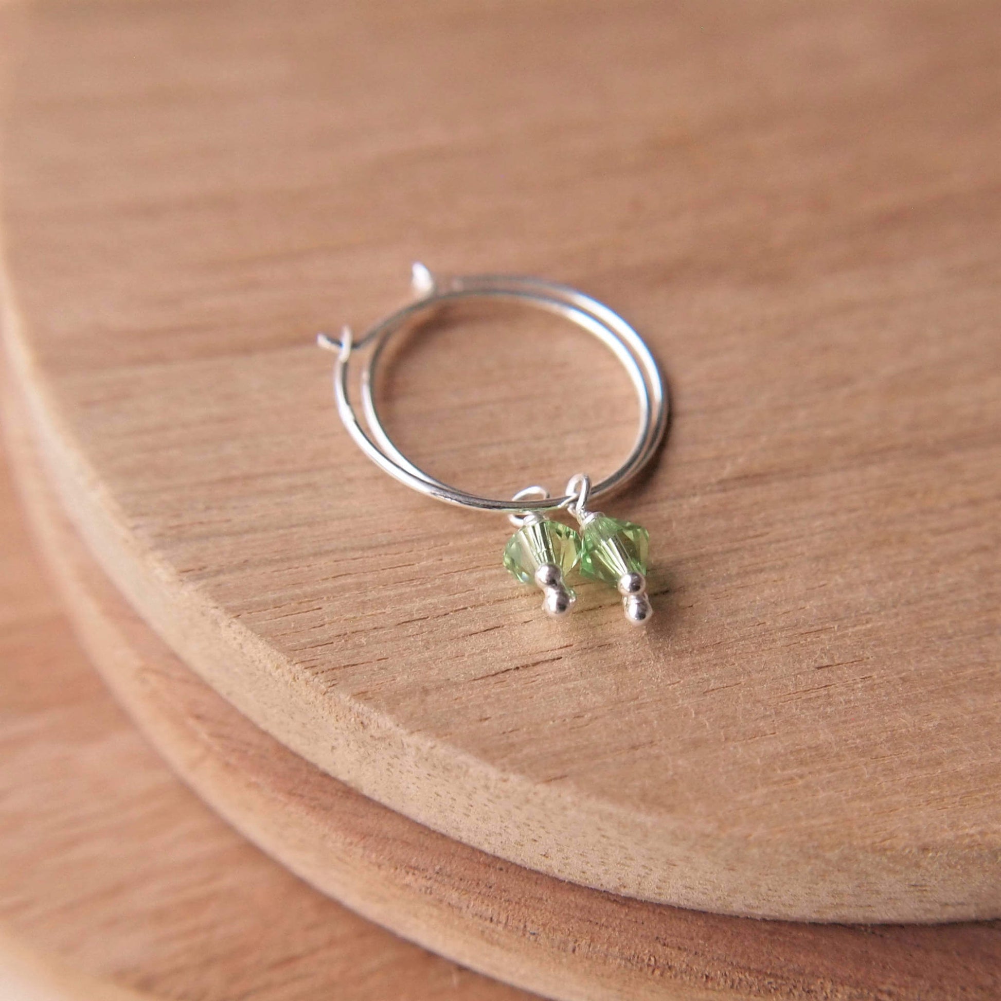 small simple hoops with birthstone crystal in green (August birthstone peridot)
