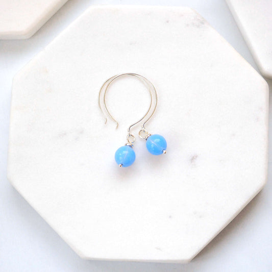 Pale baby blue Silver minimalist handmade silver hoops. Handcrafted ear wires with a round glass bead dropper. Made in Scotland by maram jewellery