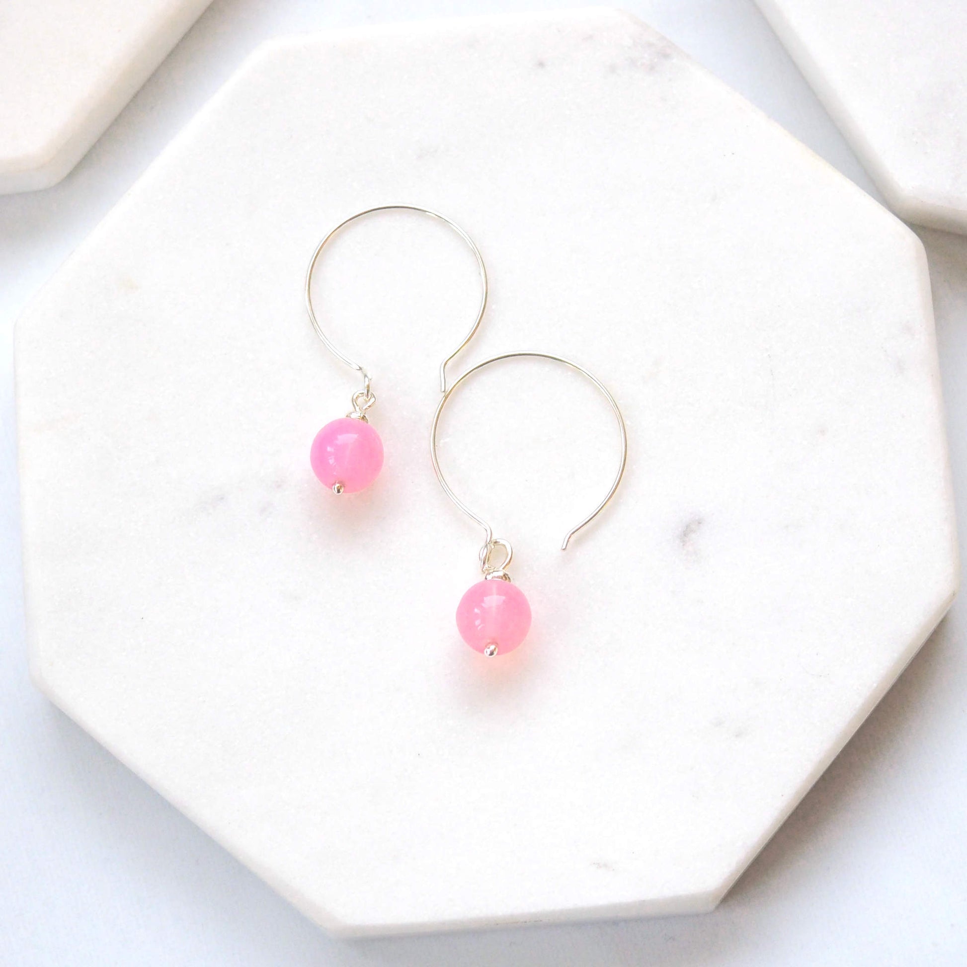 Pale Pink Silver minimalist handmade silver hoops. Handcrafted ear wires with a round glass bead dropper. Made in Scotland by maram jewellery