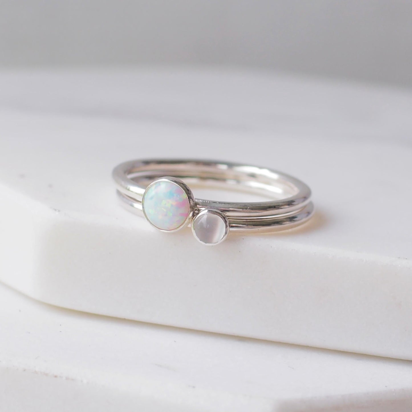 Two silver rings with lal Opal and Moonstone gemstones. Birthstones for June and October. Handmade to your ring size by maram jewellery in Scotland , UK