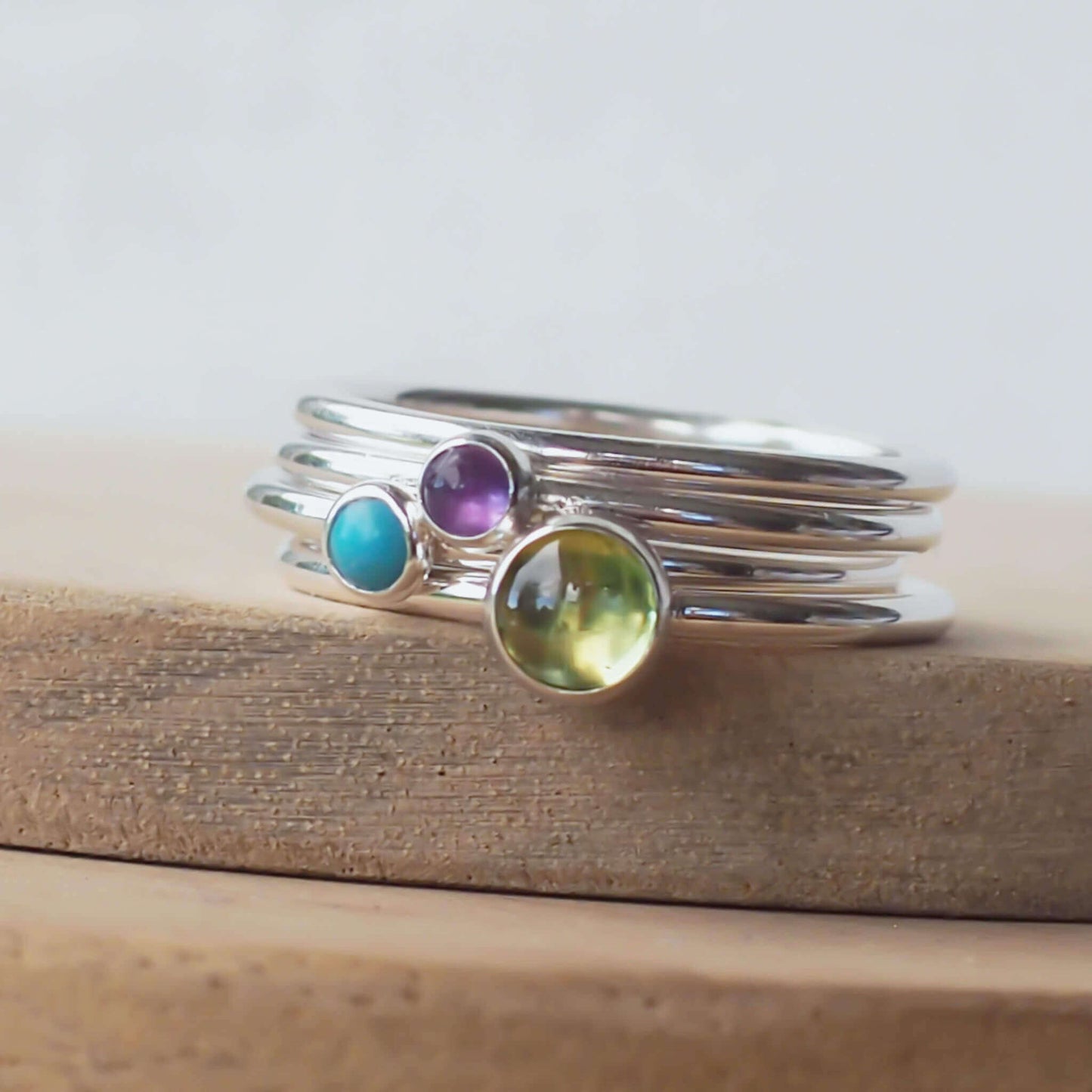 three ring set with green, purple and turquoise gemstones. Handmade in Scotland by maram jewellery