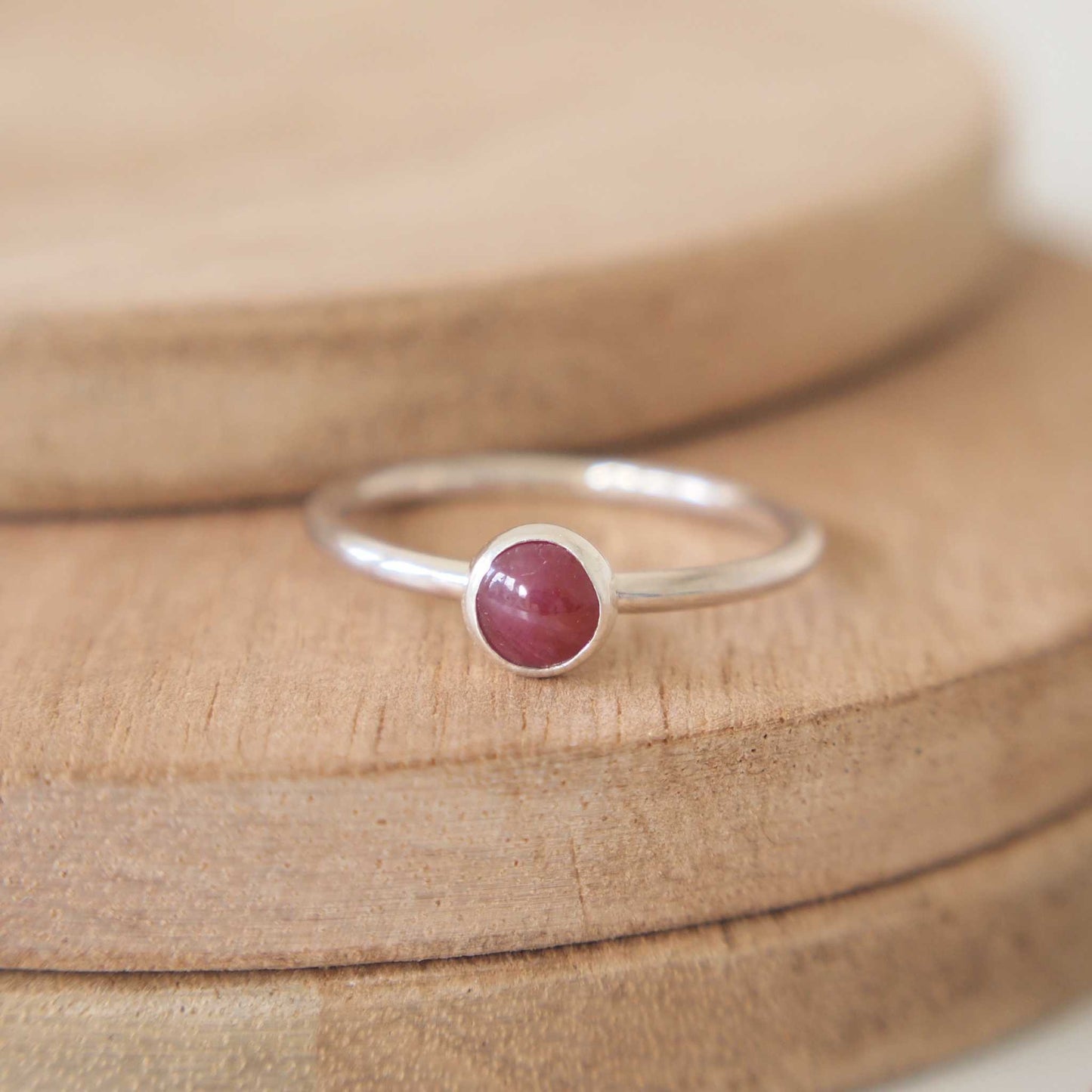 Solitaire Ruby ring in Silver and natural Ruby. A modern minimalist ring made to measure to your ring size by maram jewellery in the UK