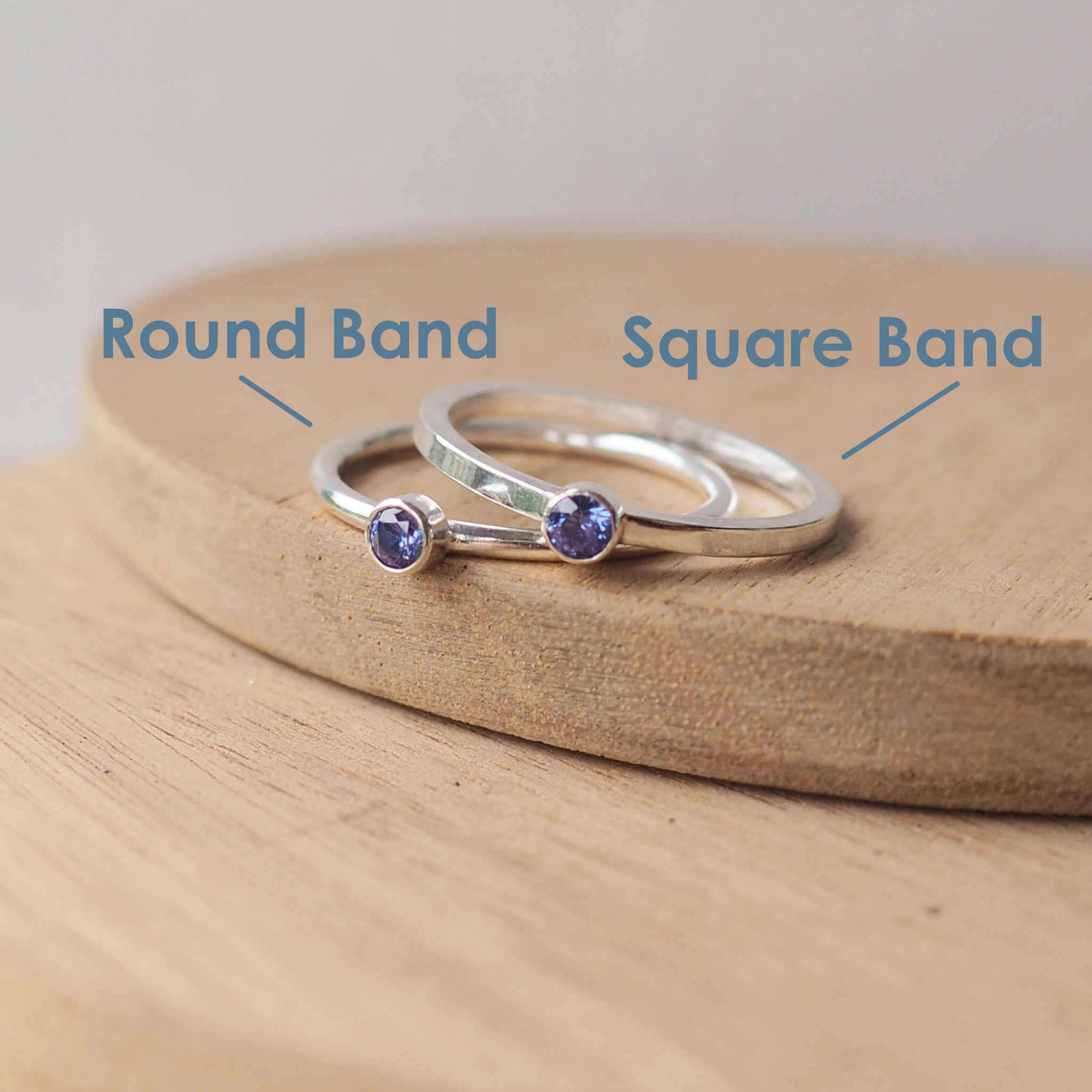 Two rings showing the square and round band styles with 3mm tanzanite cubic zirconia gemstones. The rings are made from Sterling Silver and a round violet cubic zirconia measuring 3mm in size. Handmade by maram jewellery in Scotland