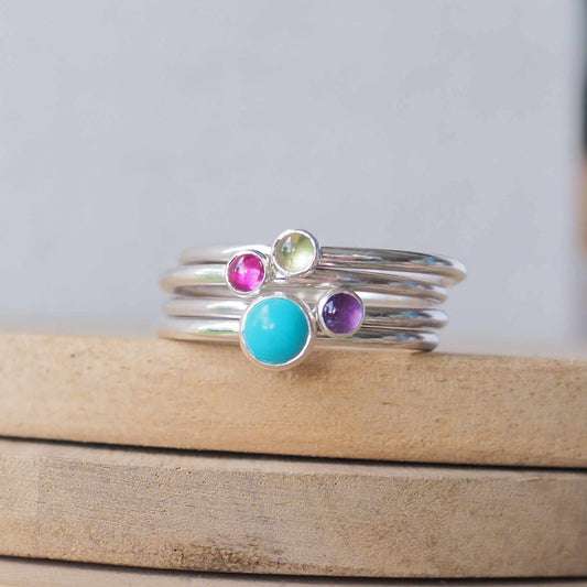 Four ring set with turquoise peridot amethyst and lab ruby. Made in Scotland by maram jewellery