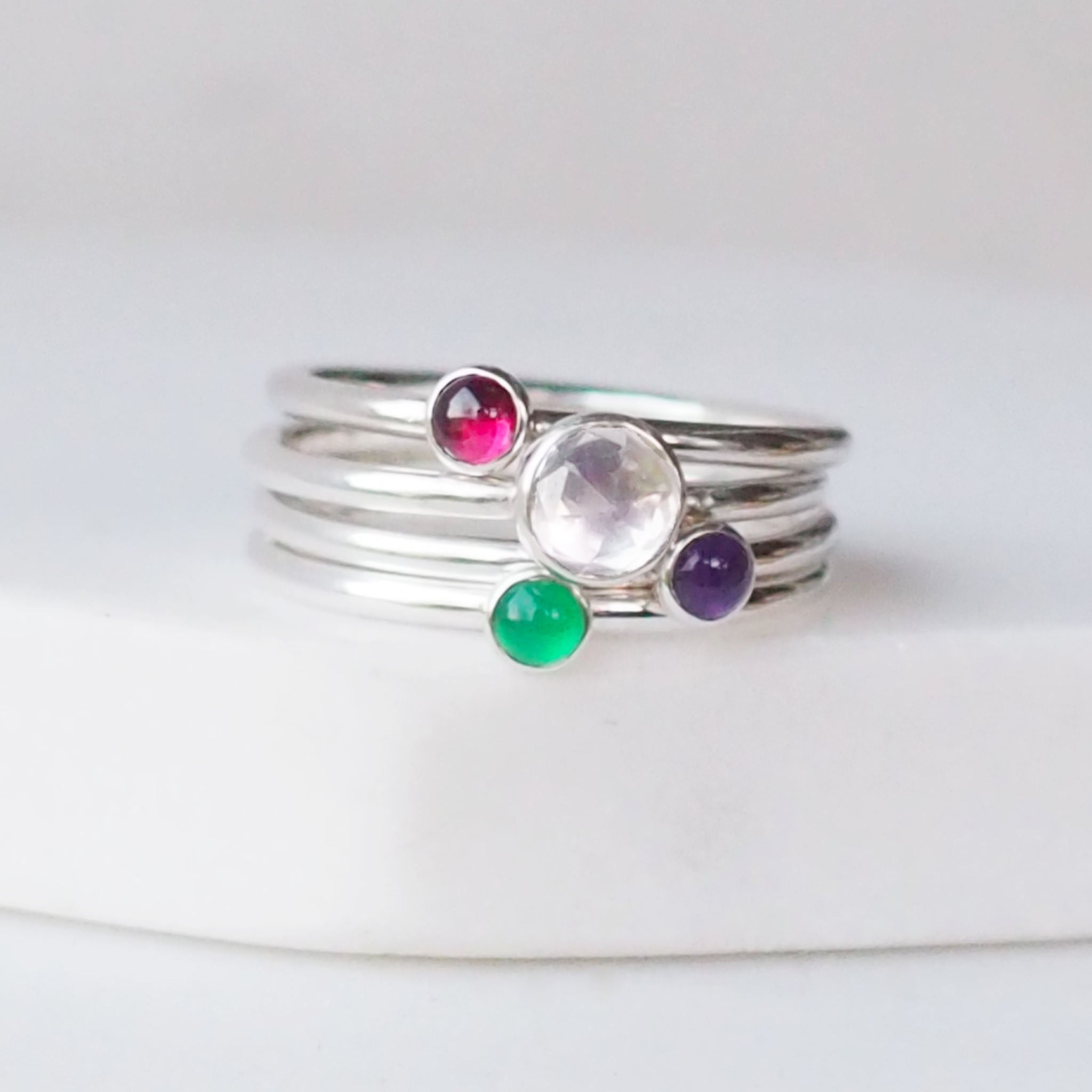 White Topaz, Garnet, Green Agate, and Amethyst four ring birthstone ring set with birthstones for April, January, February and May .Handmade in Scotland by maram jewellery