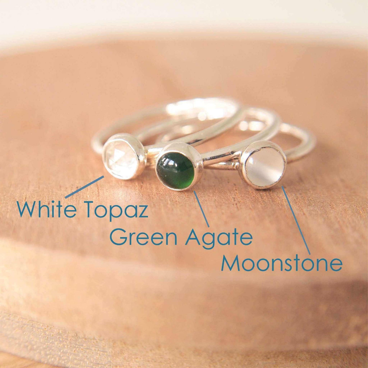 Three Silver rings, each set simply with a single gemstone in Green Agate, White Topaz and Moonstone in a round 5mm size. Birthstones for April, May and June. Handmade by Maram Jewellery in Edinburgh