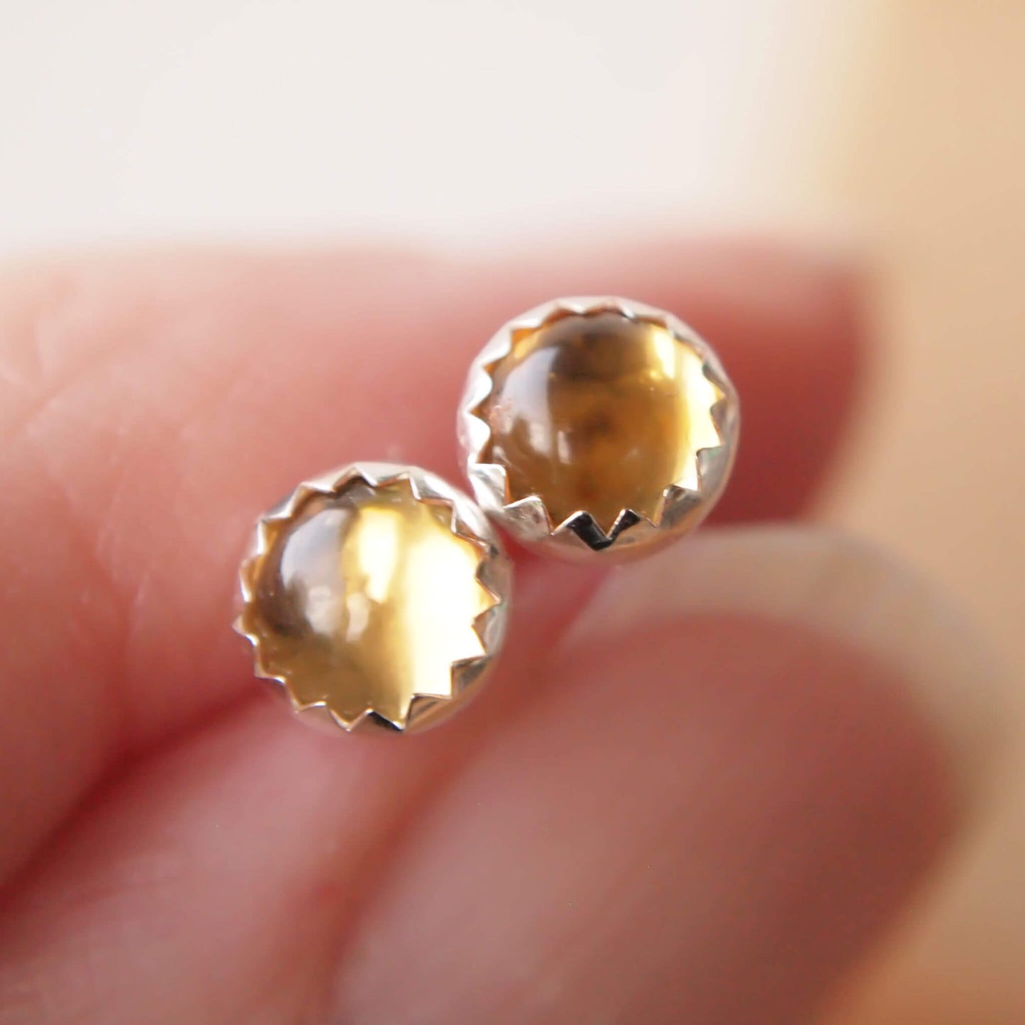 November Birthstone Silver Stud earrings made from a pair of round yellow citrines set simply in Sterling Silver. Minimalist Sterling SIlver handmade by maram jewellery in UK