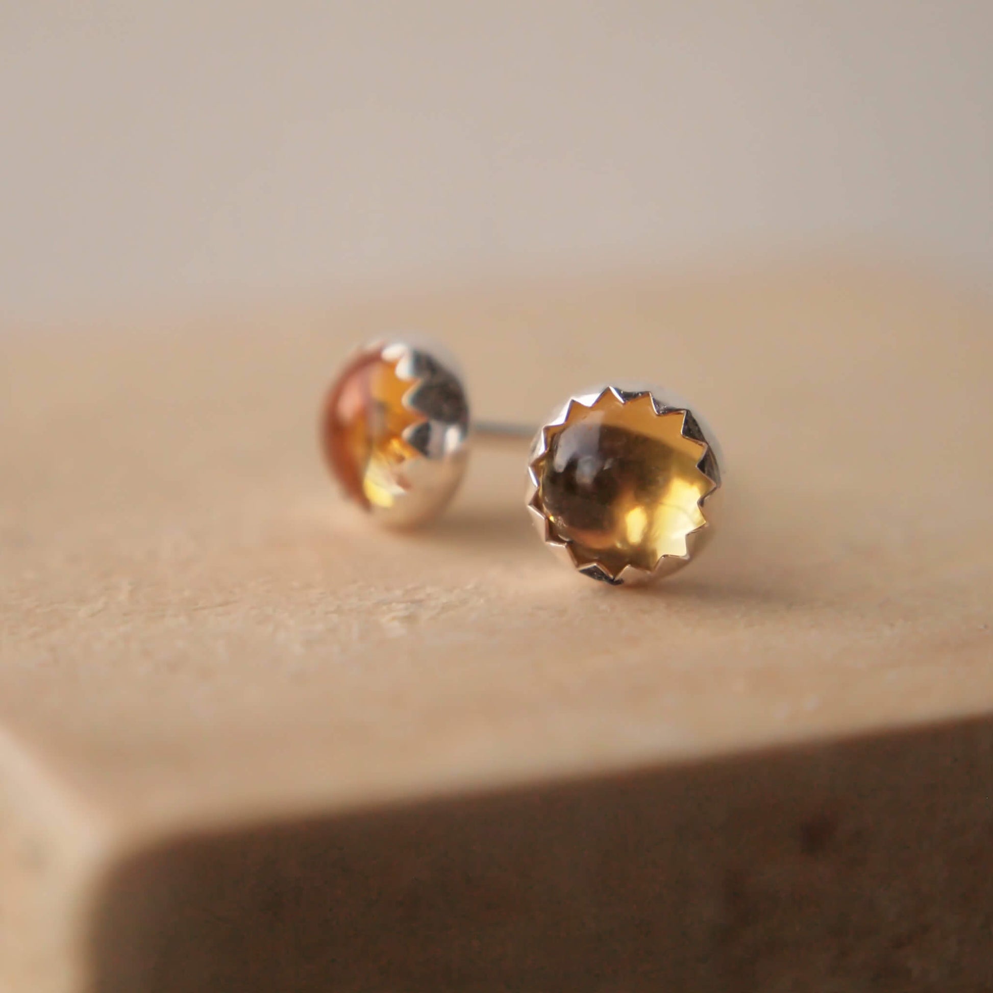 Citrine Gemstone Stud earrings made from round November birthstone gems 5mm in size and set in a simple sterling silver setting. handcrafted by maram jewellery in the UK