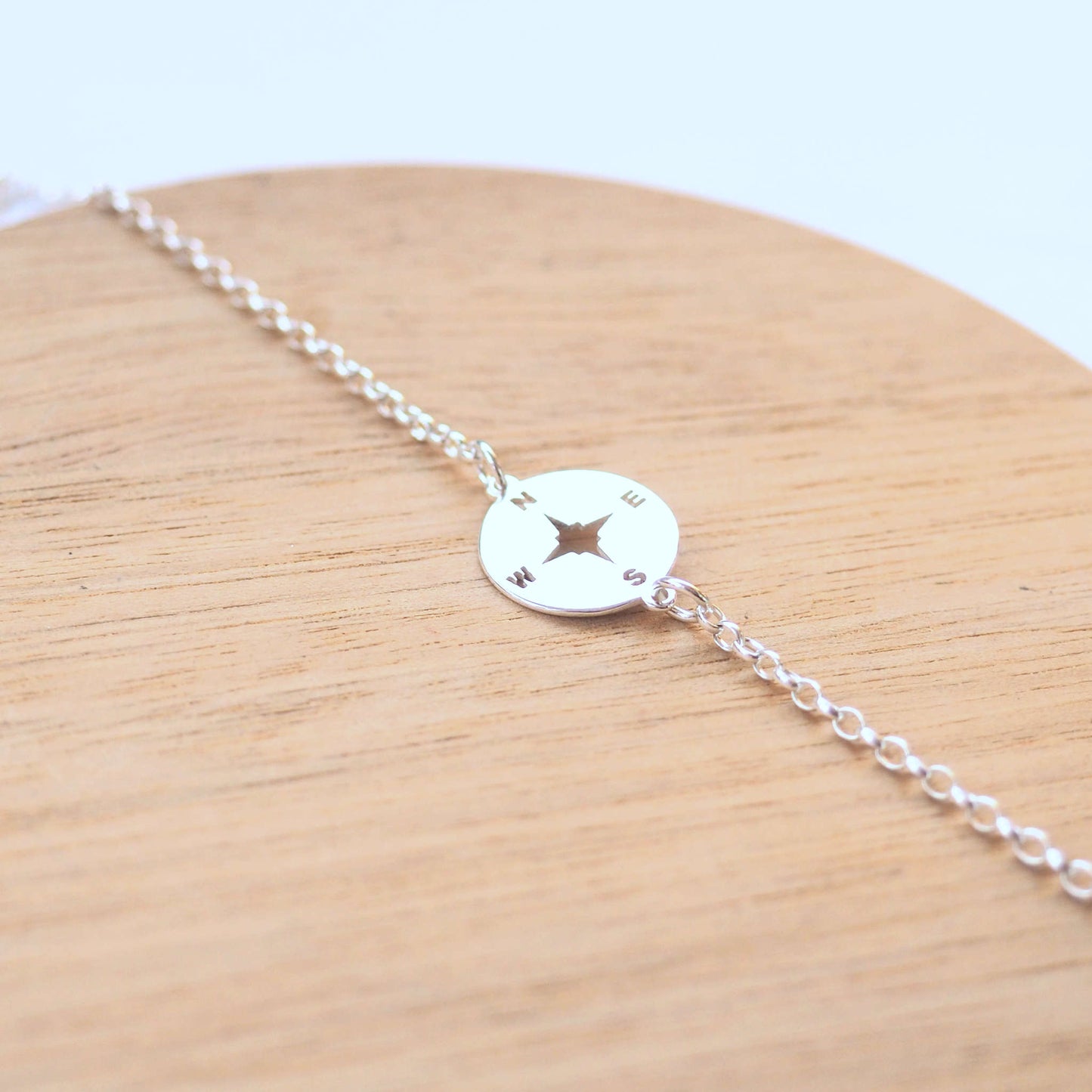 Compass Silver bracelet with a circle stamped direction compass as a centre focal. Handmade by maram jewellery in Edinburgh UK