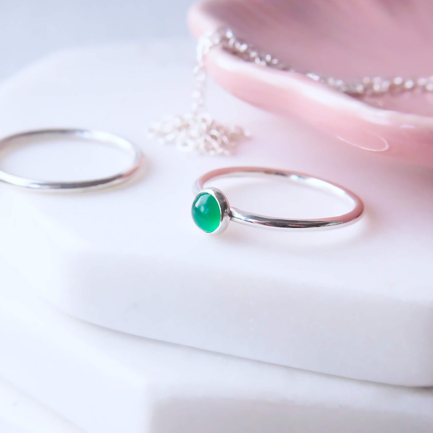 Green Agate Birthstone Ring for May. A round 5mm Emerald Green Agate Cabochon set onto a simple band of Sterling Silver. Handmade to your ring size by maram jewellery in UK