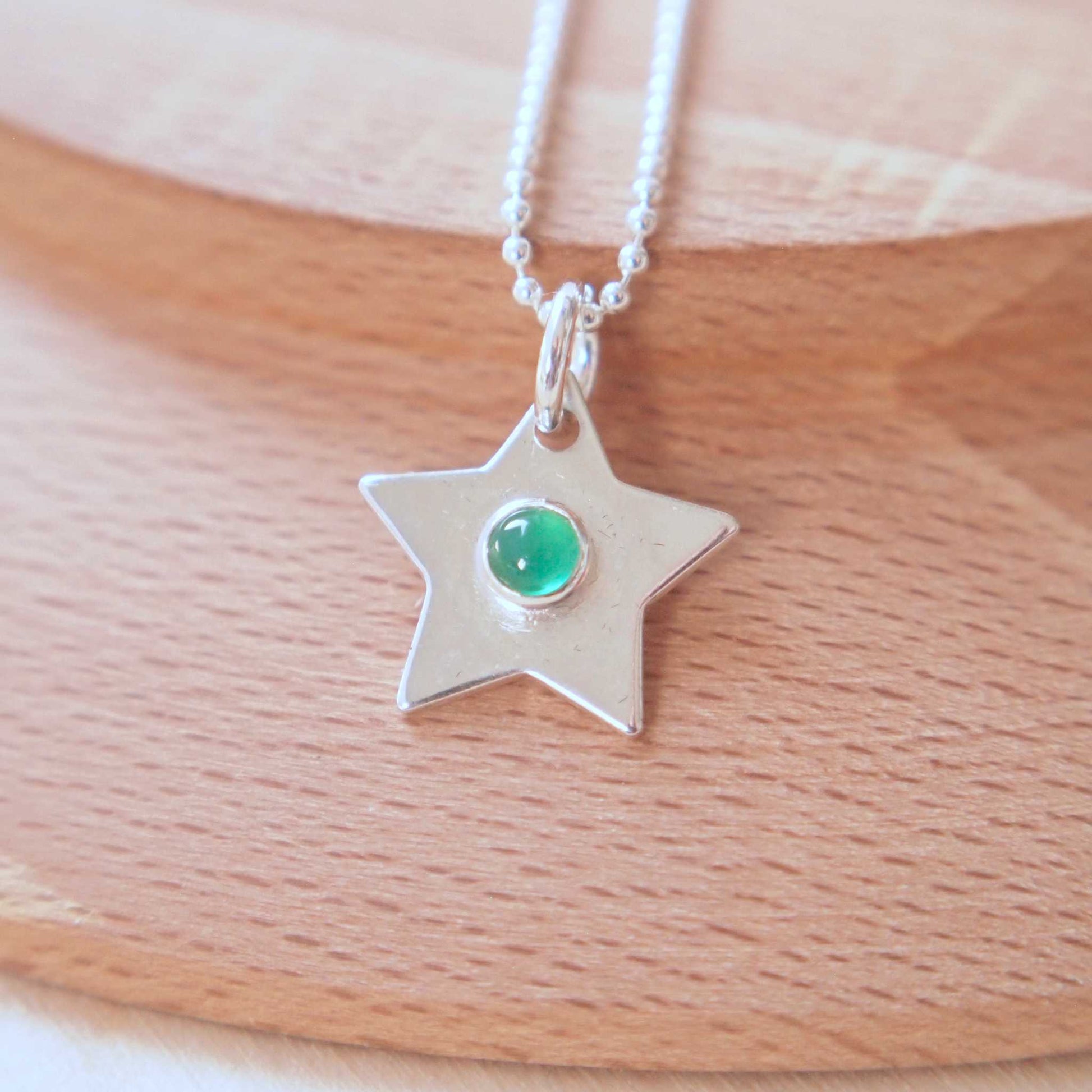 May Birthstone Star charm in Sterling SIlver with a green agate centre. Handmade in Scotland by maram jewellery