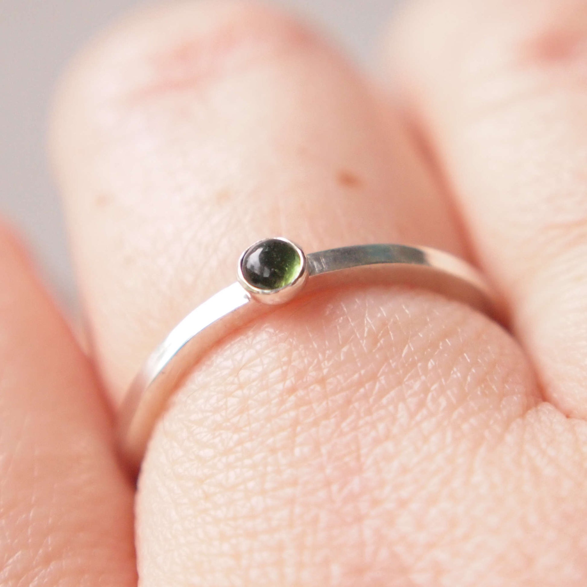 Small Green Tourmaline gemstone ring in sterling silver with a square band with a 3mm sized dark mossy green tourmaline, which is the birthstone for October. Handmade in Edinburgh by Maram Jewellery