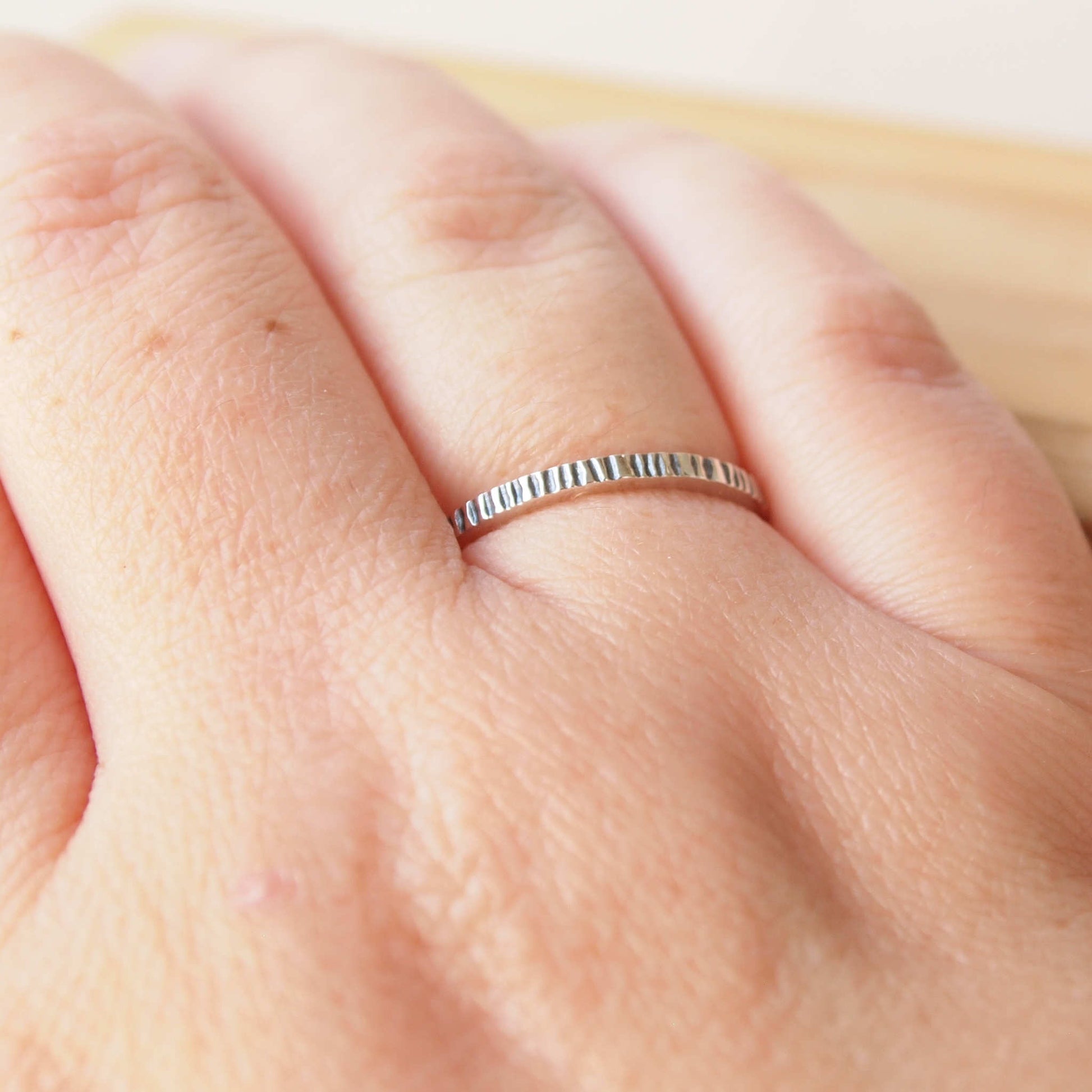 Silver plain band ring with lines pattern. ideal for stacking with other rings. Handmade in Scotland by maram jewellery