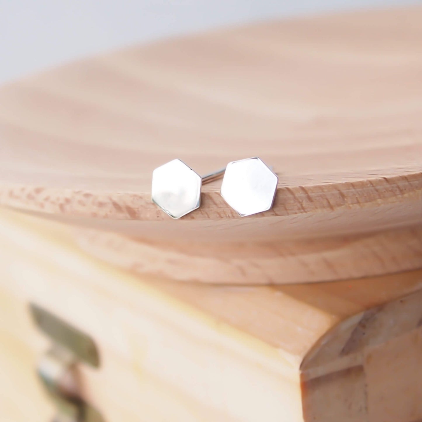Sterling Silver small stud earrings with an hexagon design. The earrings are small and perfect for wearing in multiple piercings. The earrings are made from Sterling Silver, come with Butterfly Earring backs and are handmade by maram jewellery