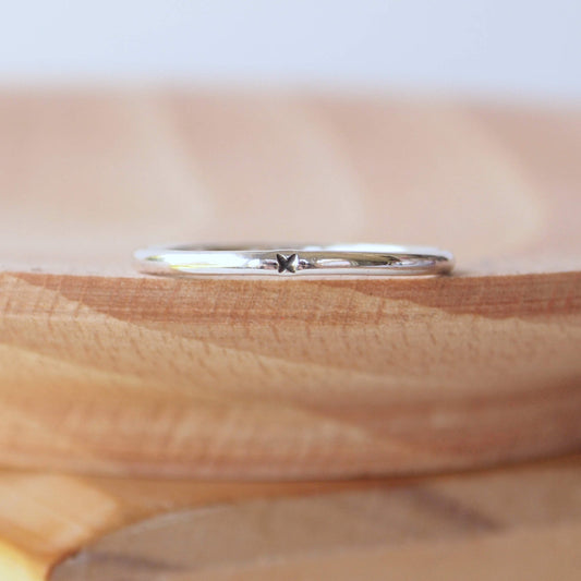 Plain silver round wedding band with an x stamped in black. Sterling Silver simple style promise ring that's also a sentimental ring for partner or child. Handmade in Scotland by maram jewellery
