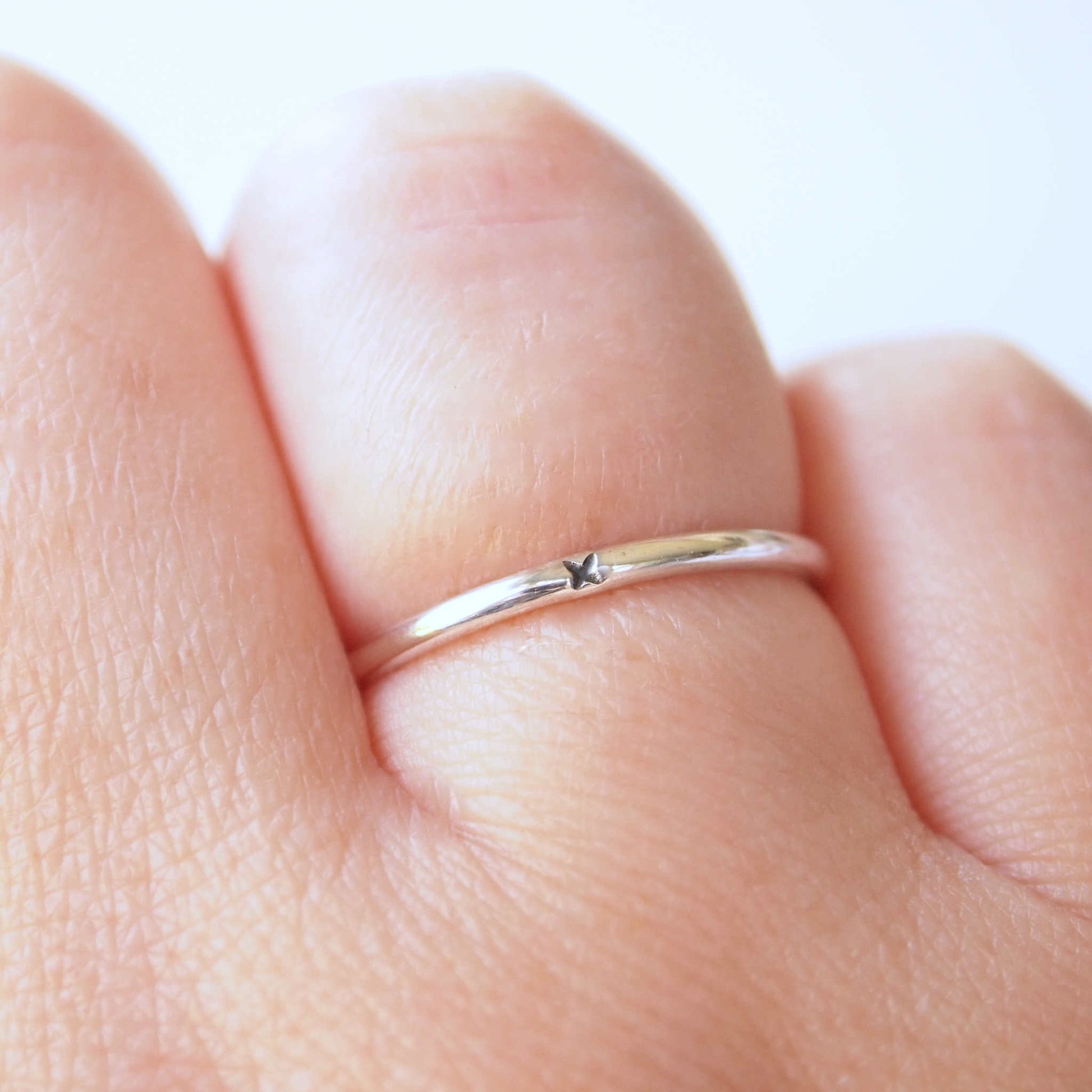 Plain silver round wedding band with an x stamped in black. Sterling Silver simple style promise ring that's also a sentimental ring for partner or child. Handmade in Scotland by maram jewellery